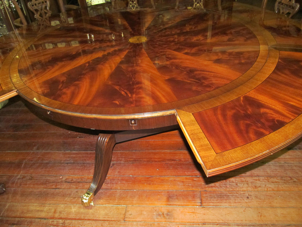 https://a.1stdibscdn.com/benchmade-bookmatched-flame-mahogany-perimeter-leaf-circular-dining-table-for-sale-picture-18/f_18913/f_382502321707060768453/IMG_2250_master.JPG