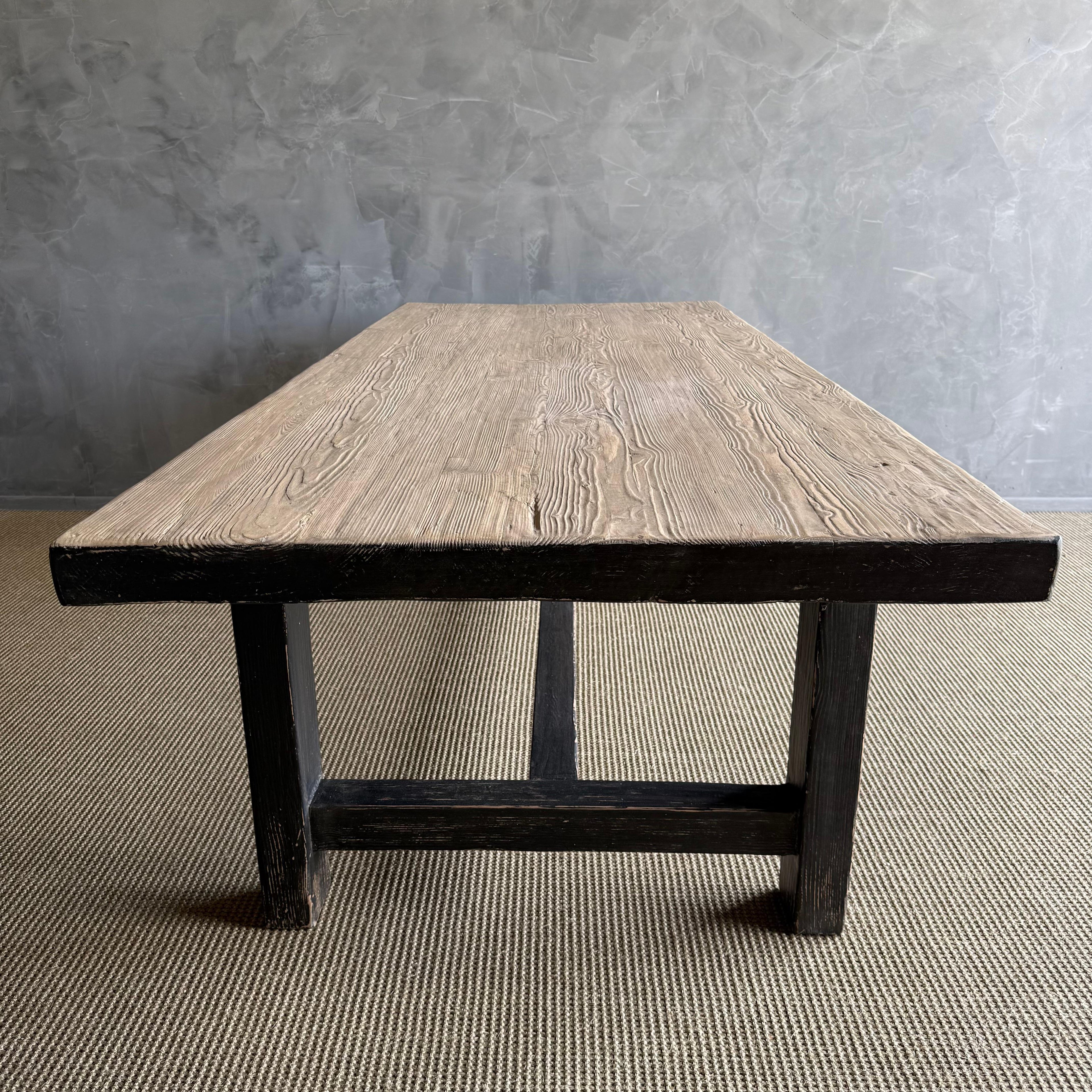 https://a.1stdibscdn.com/reclaimed-elm-wood-dining-table-in-natural-and-black-distress-for-sale-picture-3/f_18223/f_480614221766168606662/IMG_2479_master.jpeg