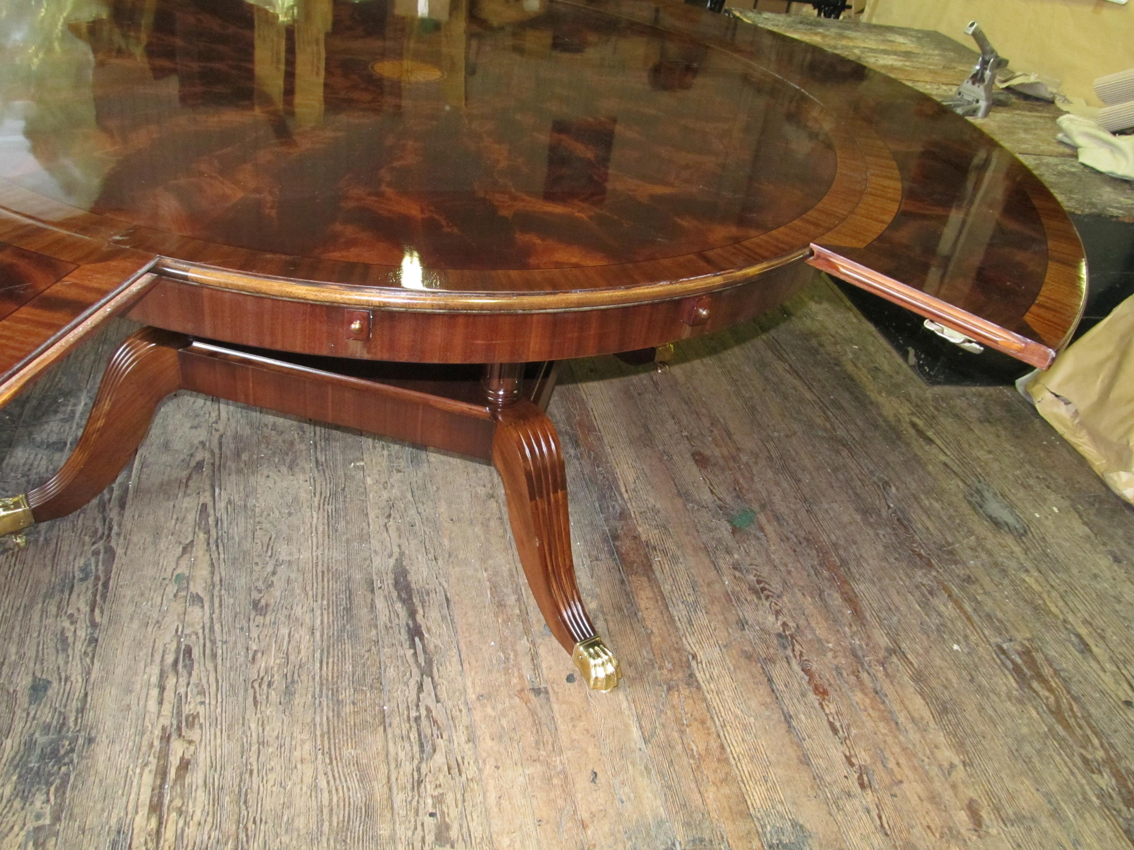 https://a.1stdibscdn.com/benchmade-bookmatched-flame-mahogany-perimeter-leaf-circular-dining-table-for-sale-picture-19/f_18913/f_382502321707060769482/IMG_3208_master.JPG