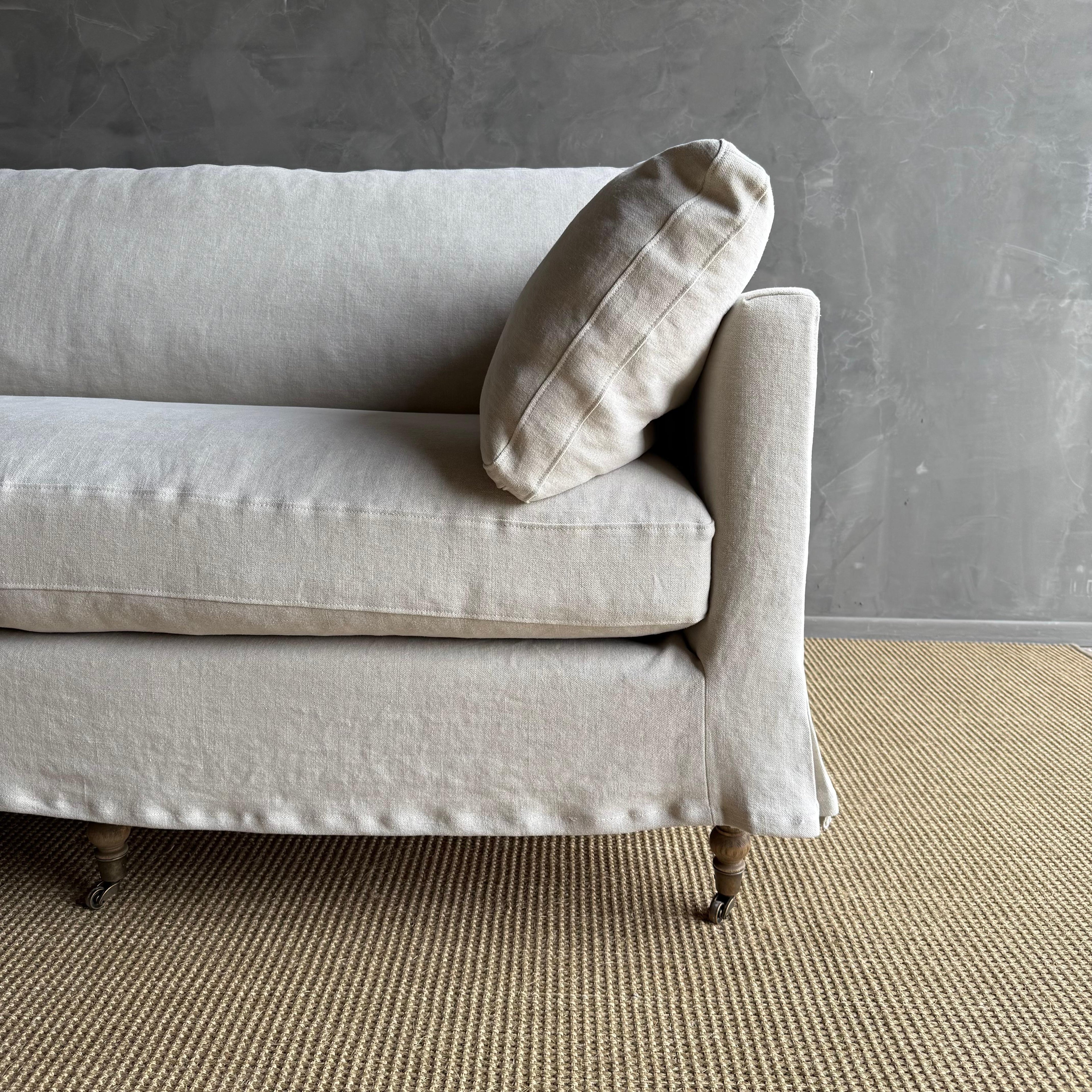 https://a.1stdibscdn.com/rudin-slip-covered-stone-washed-linen-sofa-with-down-cushions-for-sale-picture-4/f_18223/f_453499621749244463005/IMG_6326_master.jpg