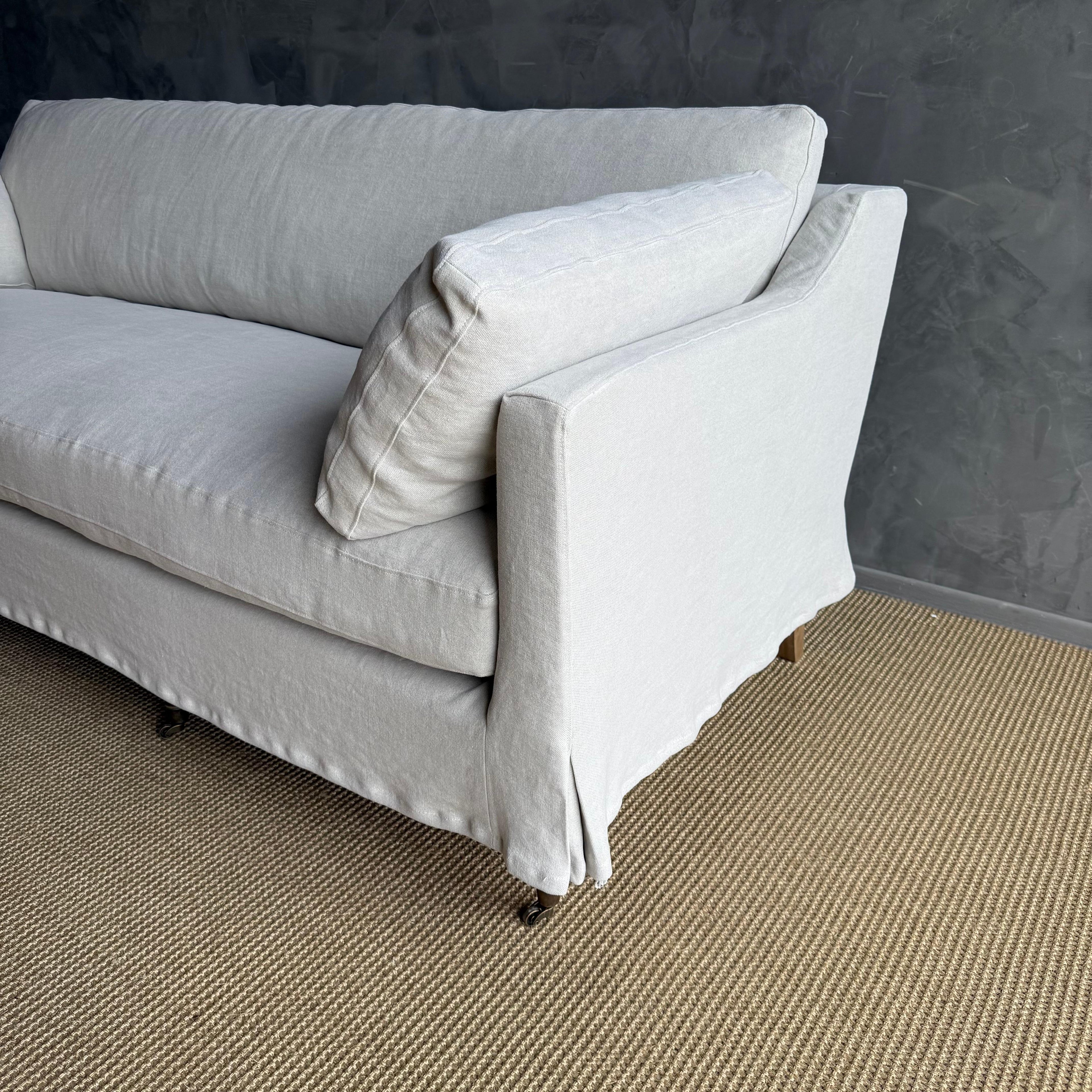 https://a.1stdibscdn.com/rudin-slip-covered-stone-washed-linen-sofa-with-down-cushions-for-sale-picture-6/f_18223/f_453499621749244466139/IMG_6328_master.jpg
