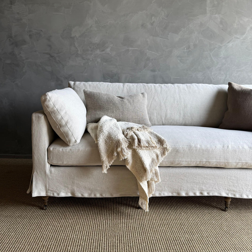 https://a.1stdibscdn.com/rudin-slip-covered-stone-washed-linen-sofa-with-down-cushions-for-sale-picture-7/f_18223/f_453499621749244466284/IMG_6330_master.jpg