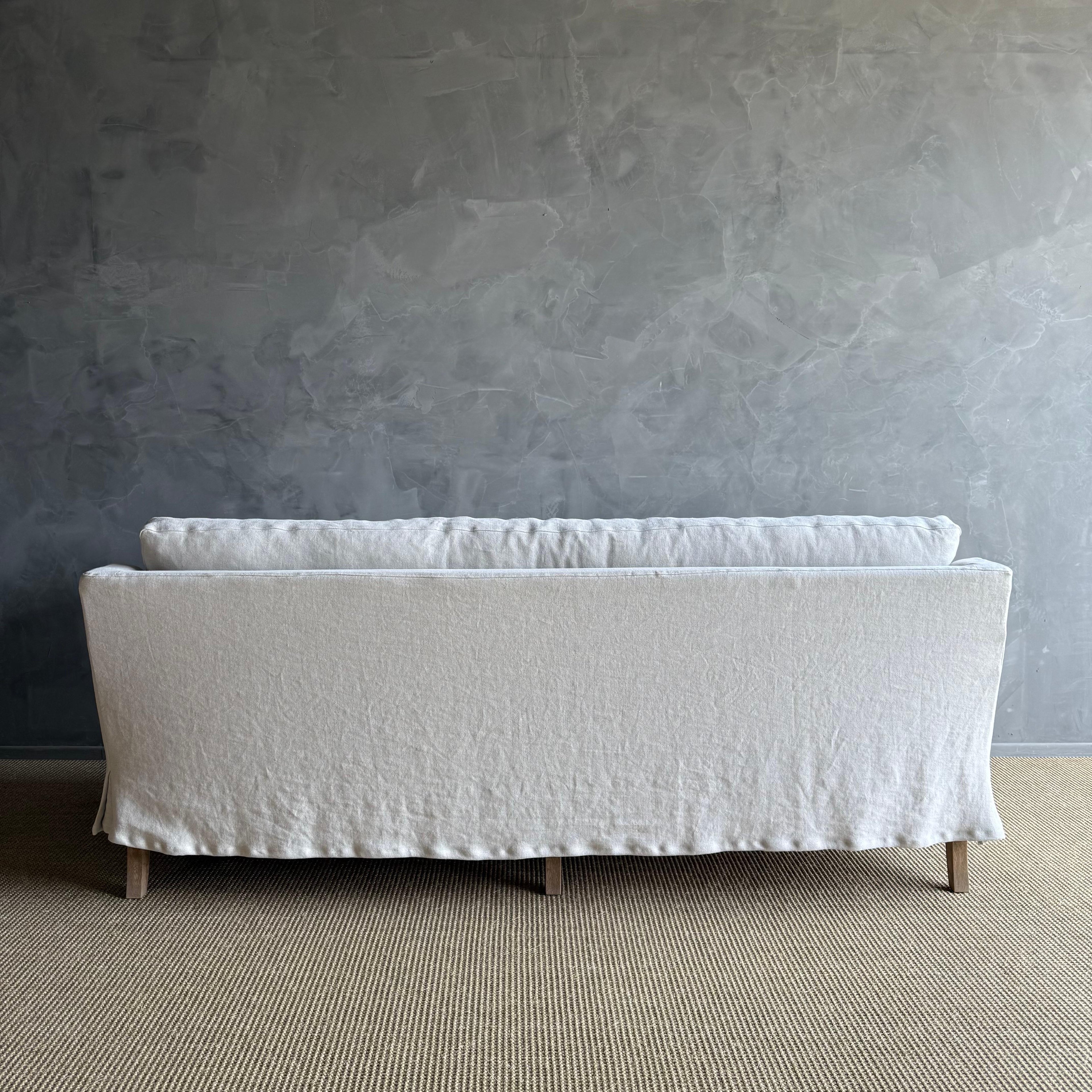 https://a.1stdibscdn.com/rudin-slip-covered-stone-washed-linen-sofa-with-down-cushions-for-sale-picture-10/f_18223/f_453499621749244466059/IMG_6333_master.jpg