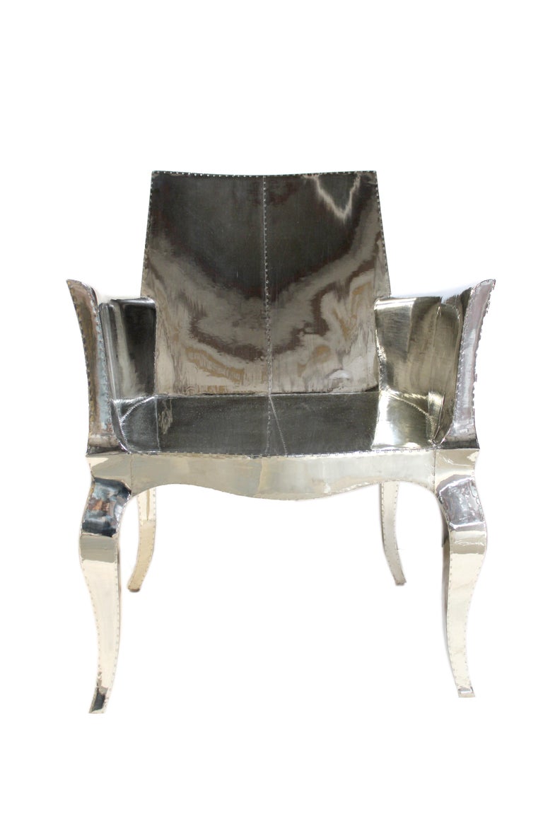 https://a.1stdibscdn.com/louis-xvi-chair-in-white-bronze-metal-clad-over-teak-club-chair-by-p-mathieu-for-sale-picture-9/f_42361/f_318031221671403656739/IMG_6703_master.JPG?width=768
