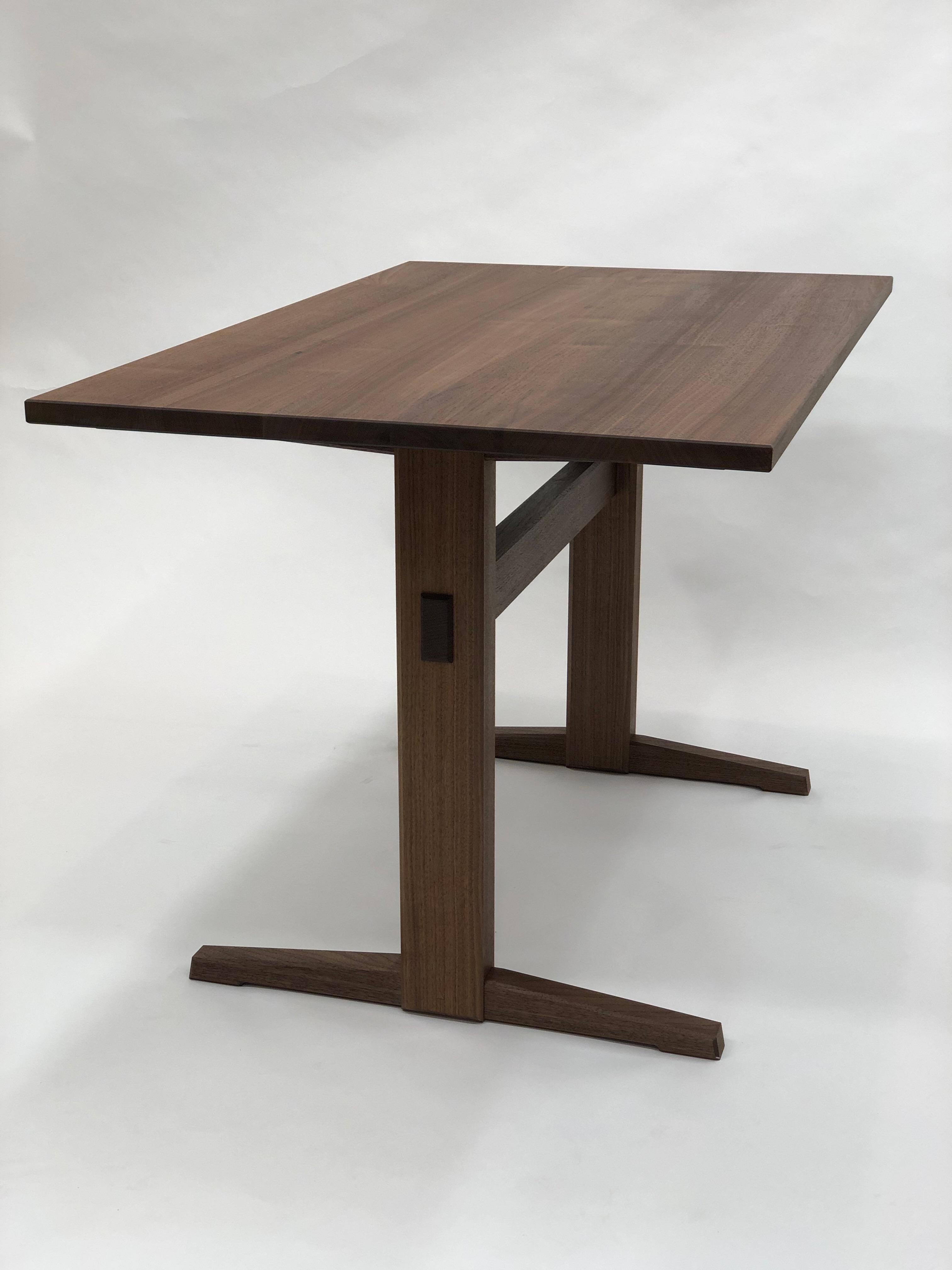 https://a.1stdibscdn.com/trestle-base-dining-table-in-quartersawn-walnut-by-brian-holcombe-for-sale-picture-4/f_45782/f_201312621596812489490/IMG_6722_master.jpeg