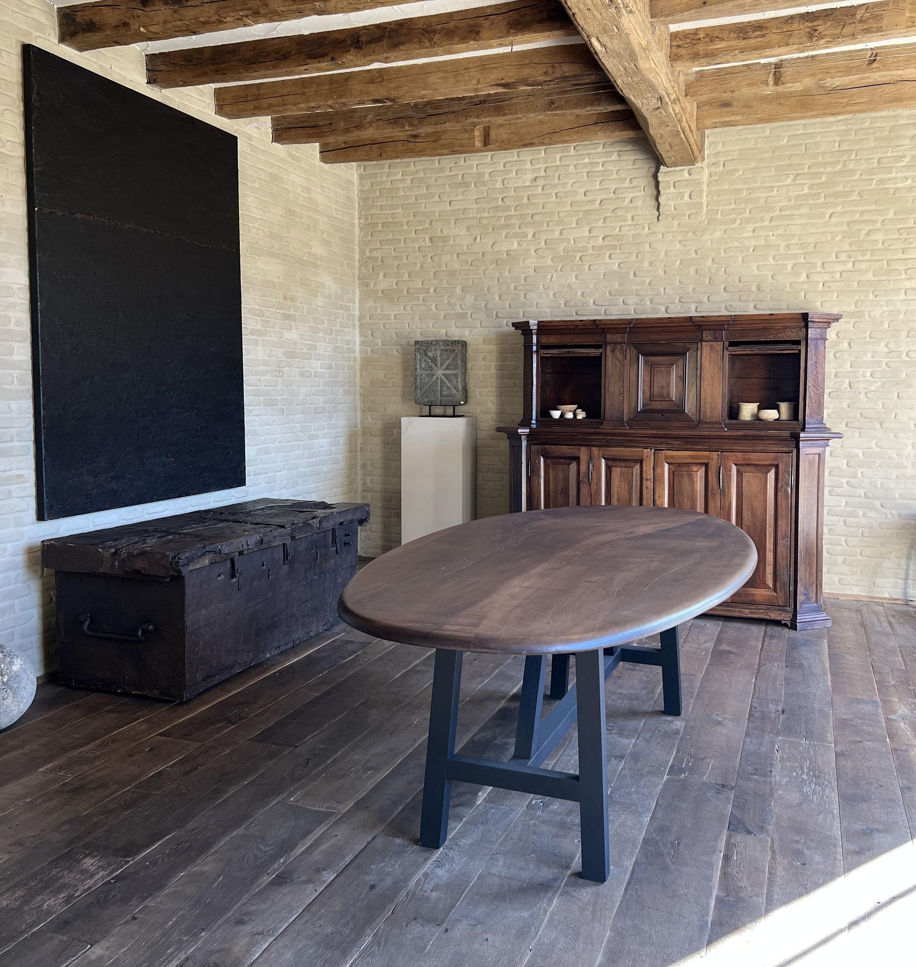 https://a.1stdibscdn.com/custom-walnut-2-plank-top-oval-dining-table-model-lusi-dark-finish-for-sale-picture-3/f_20233/f_470116321760212937520/IMG_7777_master.JPG