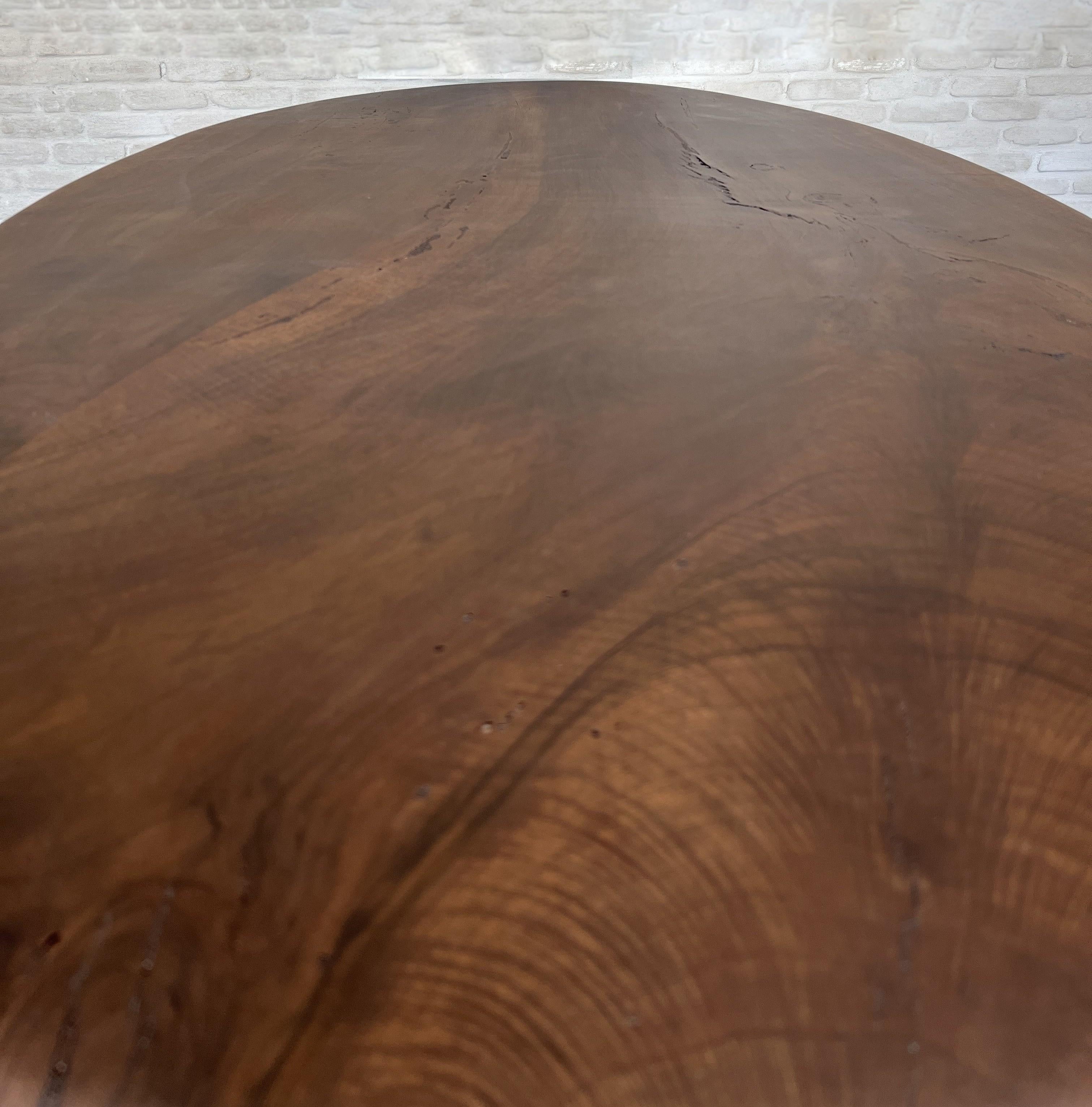 https://a.1stdibscdn.com/custom-walnut-2-plank-top-oval-dining-table-model-lusi-dark-finish-for-sale-picture-4/f_20233/f_470116321760212937648/IMG_7792_master.JPG