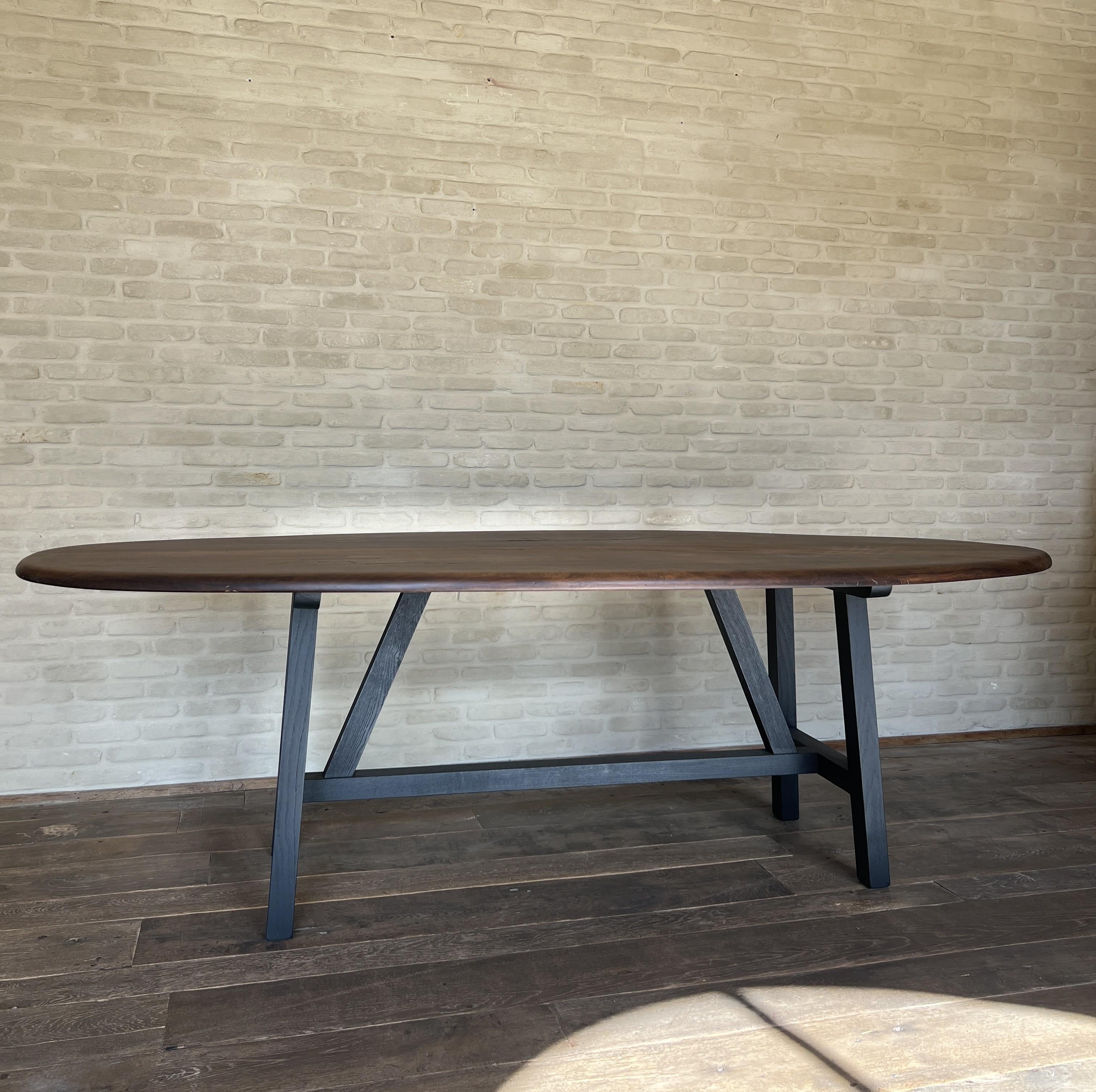 https://a.1stdibscdn.com/custom-walnut-2-plank-top-oval-dining-table-model-lusi-dark-finish-for-sale-picture-6/f_20233/f_470116321760212937601/IMG_7799_master.JPG