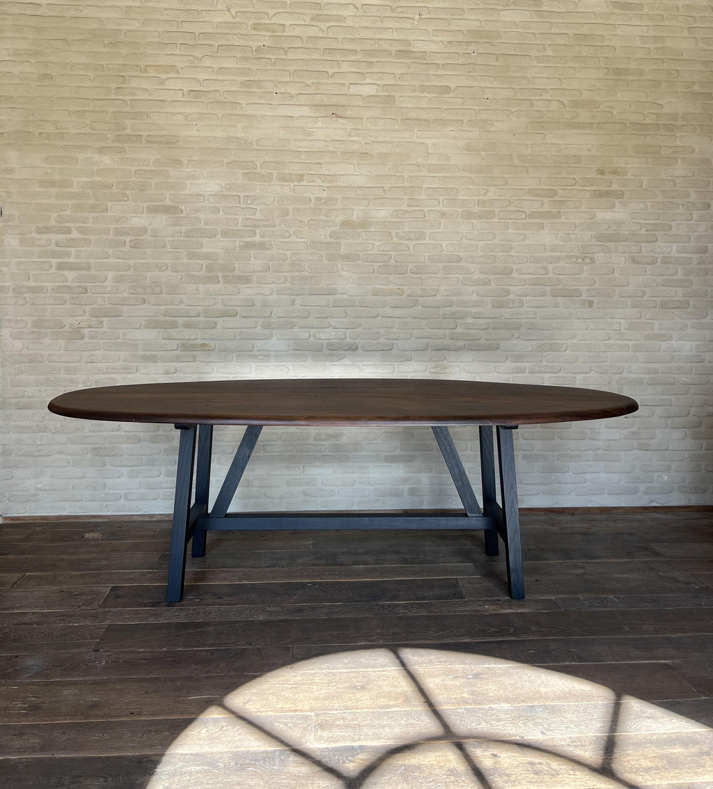 https://a.1stdibscdn.com/custom-walnut-2-plank-top-oval-dining-table-model-lusi-dark-finish-for-sale-picture-7/f_20233/f_470116321760212937234/IMG_7800_master.JPG