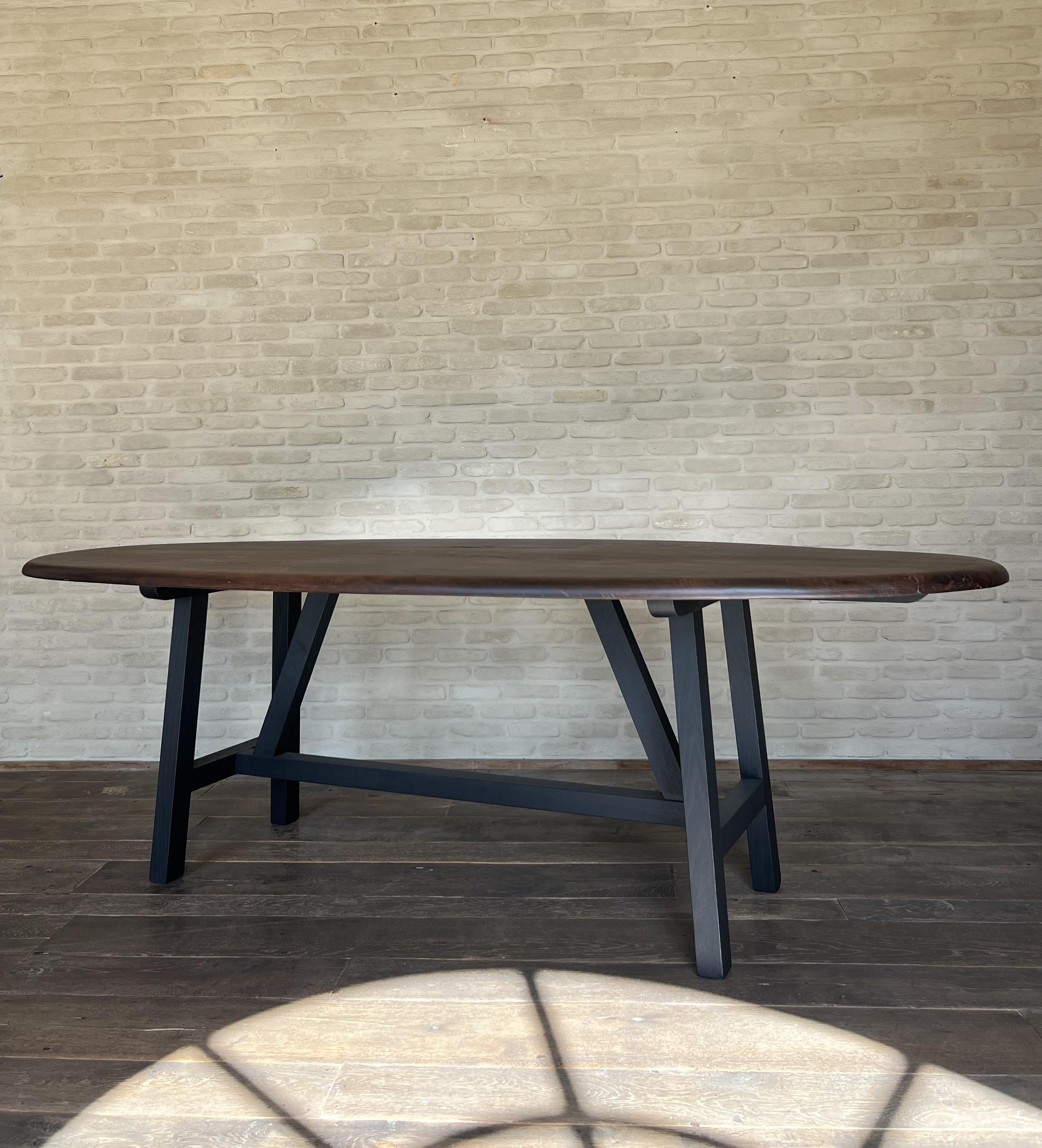 https://a.1stdibscdn.com/custom-walnut-2-plank-top-oval-dining-table-model-lusi-dark-finish-for-sale-picture-10/f_20233/f_470116321760212941652/IMG_7804_master.JPG