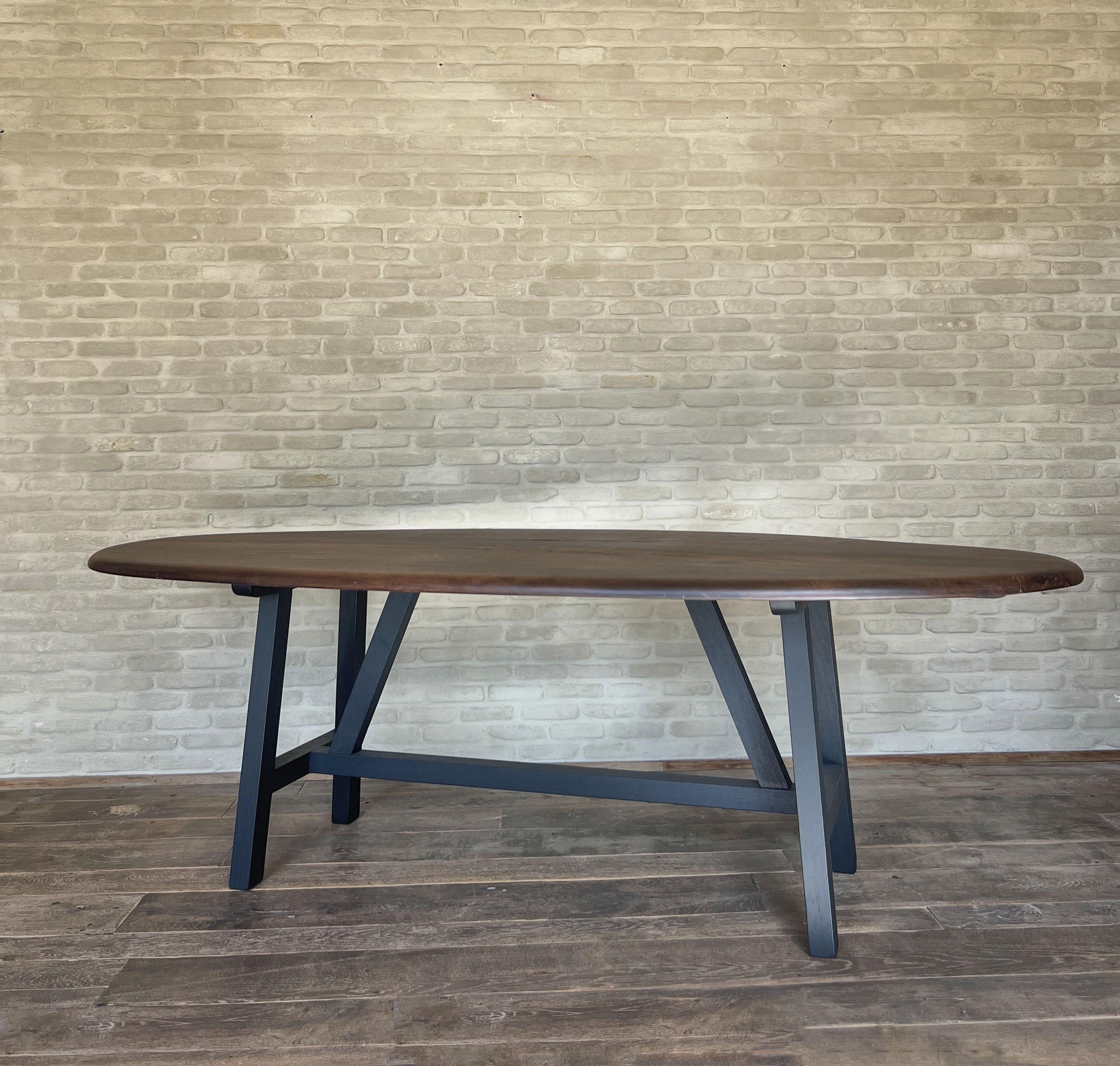https://a.1stdibscdn.com/custom-walnut-2-plank-top-oval-dining-table-model-lusi-dark-finish-for-sale-picture-11/f_20233/f_470116321760212941623/IMG_7806_kopie_master.JPG