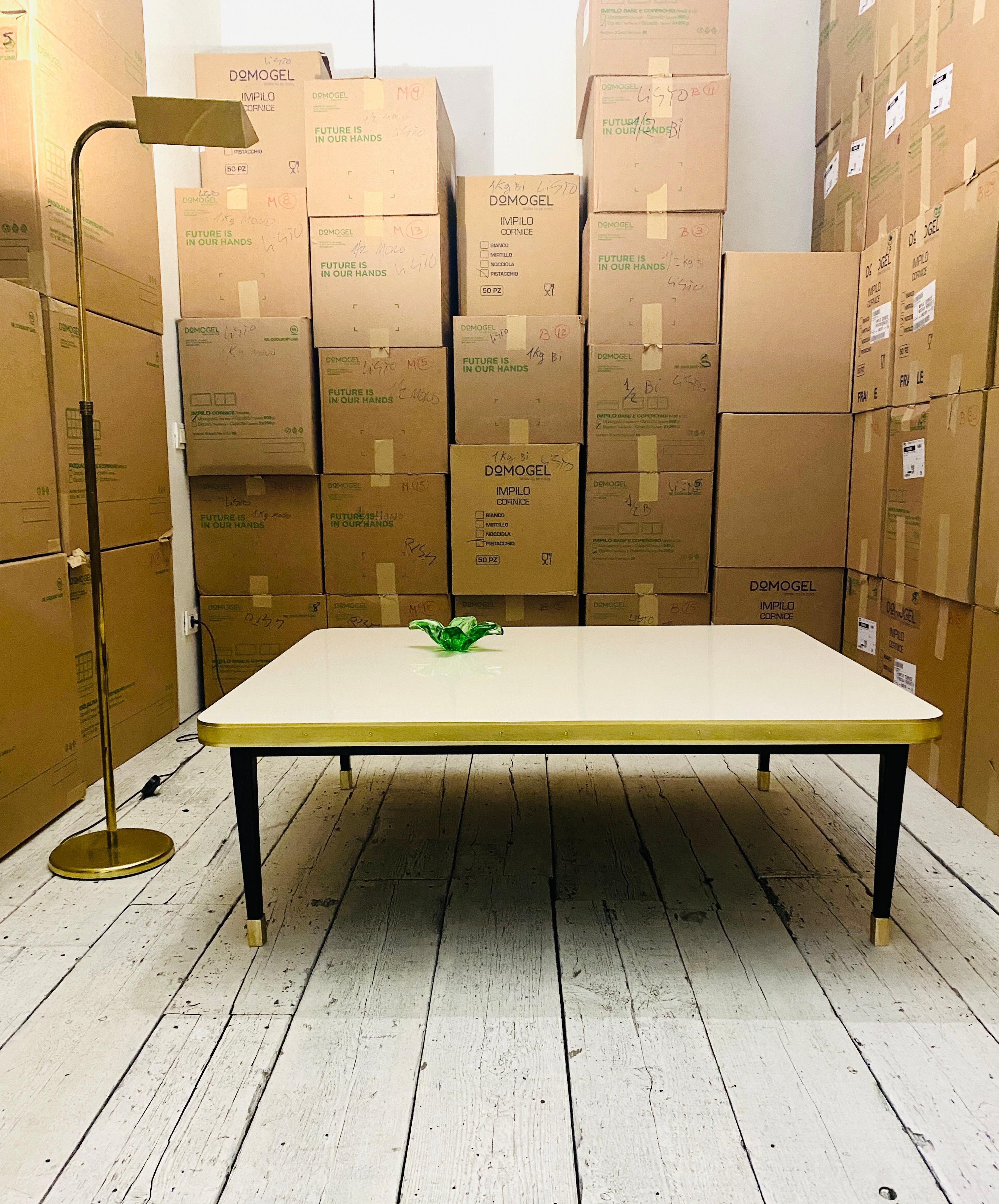 https://a.1stdibscdn.com/low-table-high-gloss-top-brass-tape-framed-black-conical-legs-brass-end-large-for-sale-picture-7/f_40561/f_338704421681831278244/IMG_8328_master.jpg
