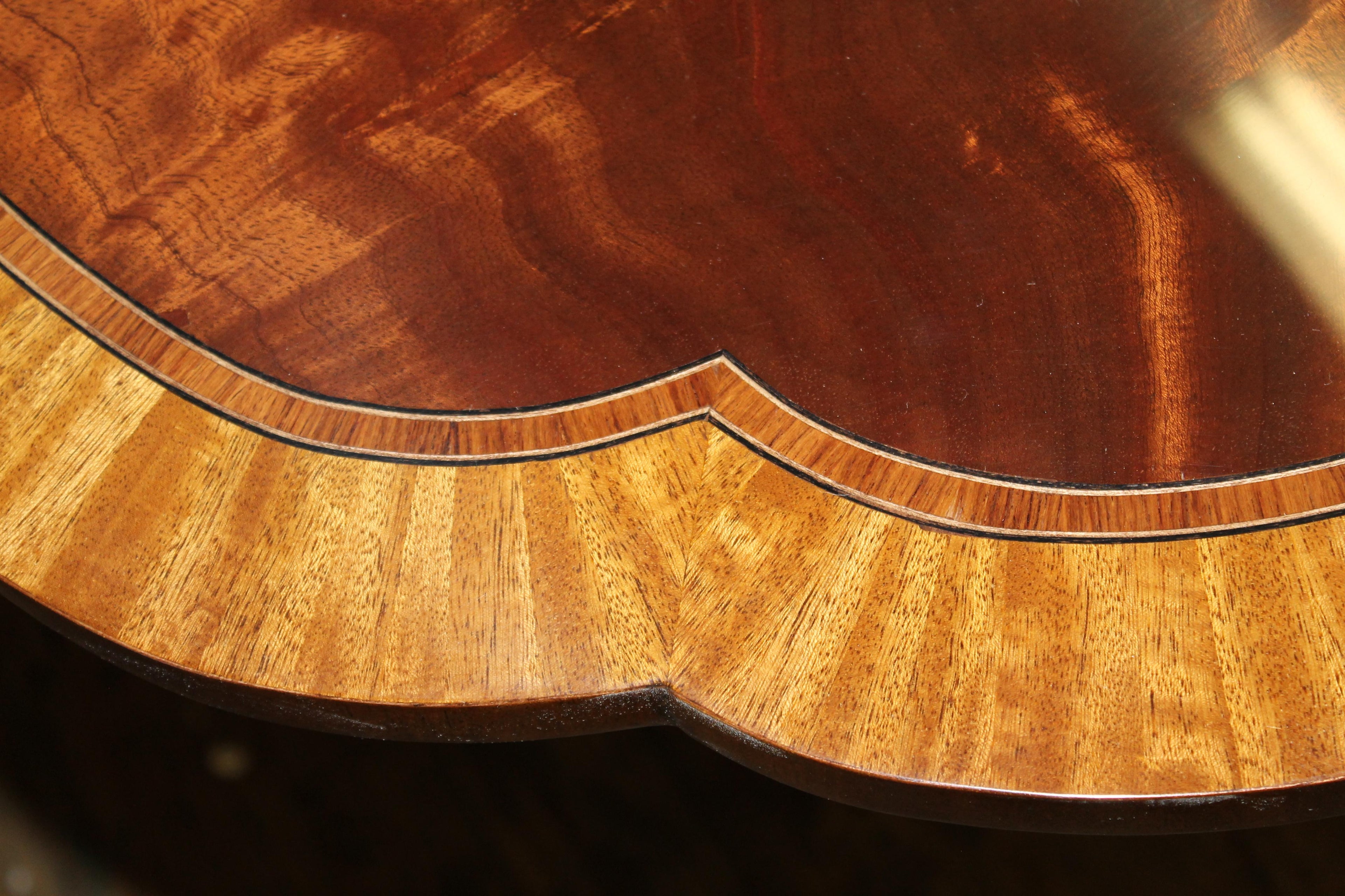 https://a.1stdibscdn.com/bench-made-reprod-inlaid-flame-mahogany-sheraton-style-three-leaf-dining-table-for-sale-picture-15/f_18913/f_251442021630533050090/IMG_8618_master.JPG