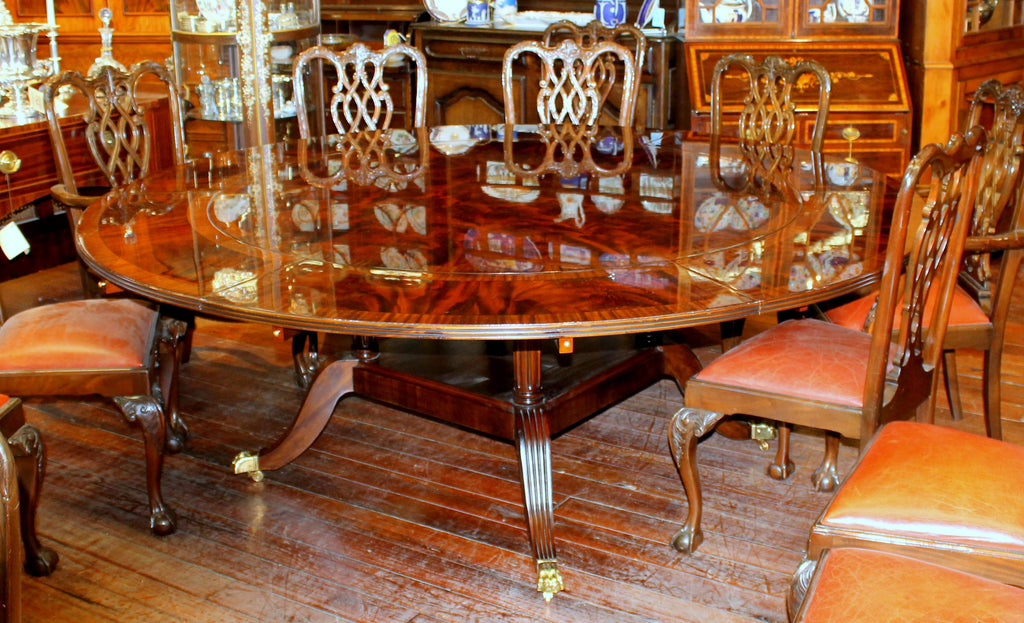 https://a.1stdibscdn.com/benchmade-bookmatched-flame-mahogany-perimeter-leaf-circular-dining-table-for-sale-picture-2/f_18913/f_382502321707060750778/IMG_8996_master.JPG