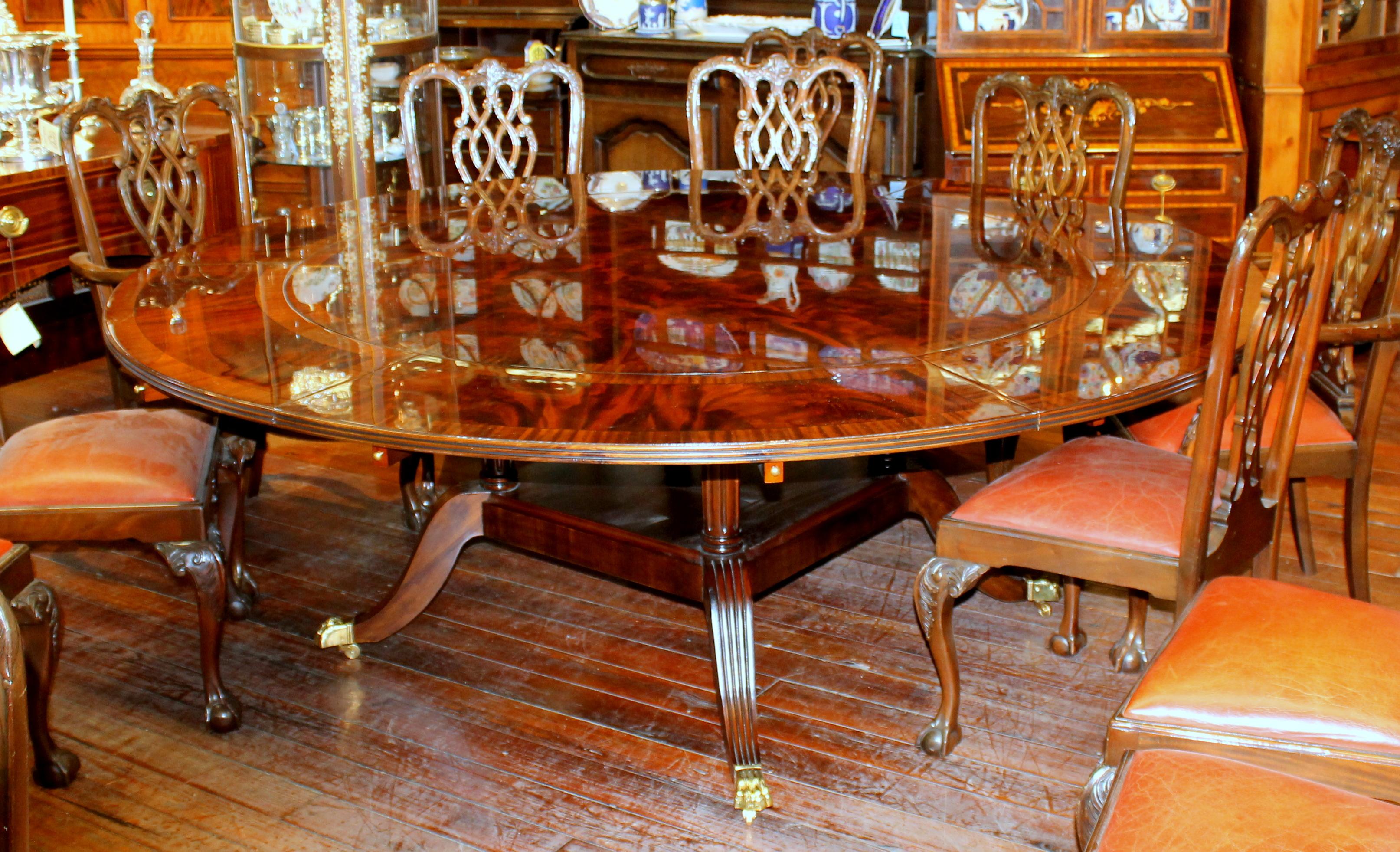 https://a.1stdibscdn.com/benchmade-bookmatched-flame-mahogany-perimeter-leaf-circular-dining-table-for-sale-picture-2/f_18913/f_382502321707060750778/IMG_8996_master.JPG