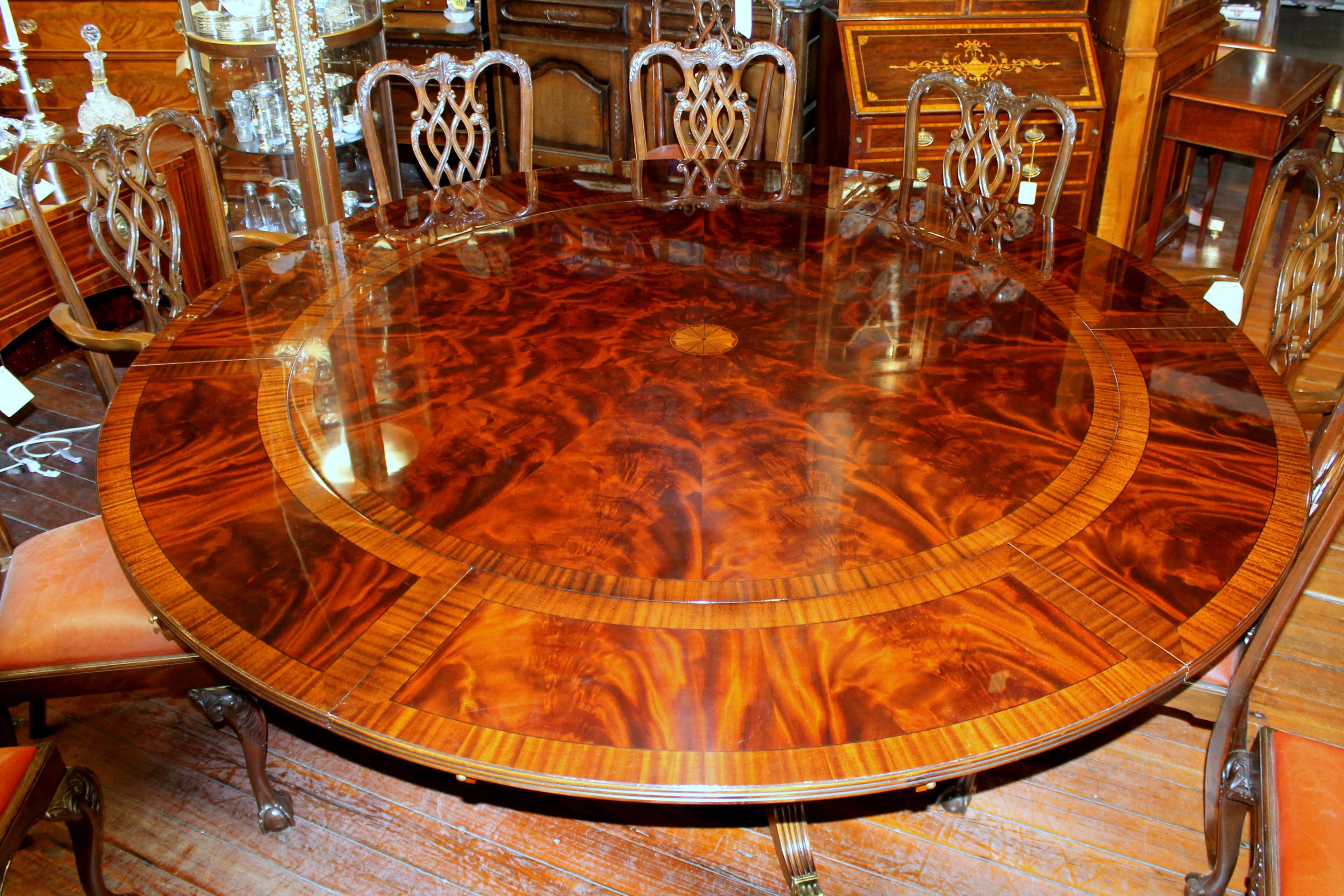 https://a.1stdibscdn.com/benchmade-bookmatched-flame-mahogany-perimeter-leaf-circular-dining-table-for-sale-picture-3/f_18913/f_382502321707060751928/IMG_8997_master.JPG