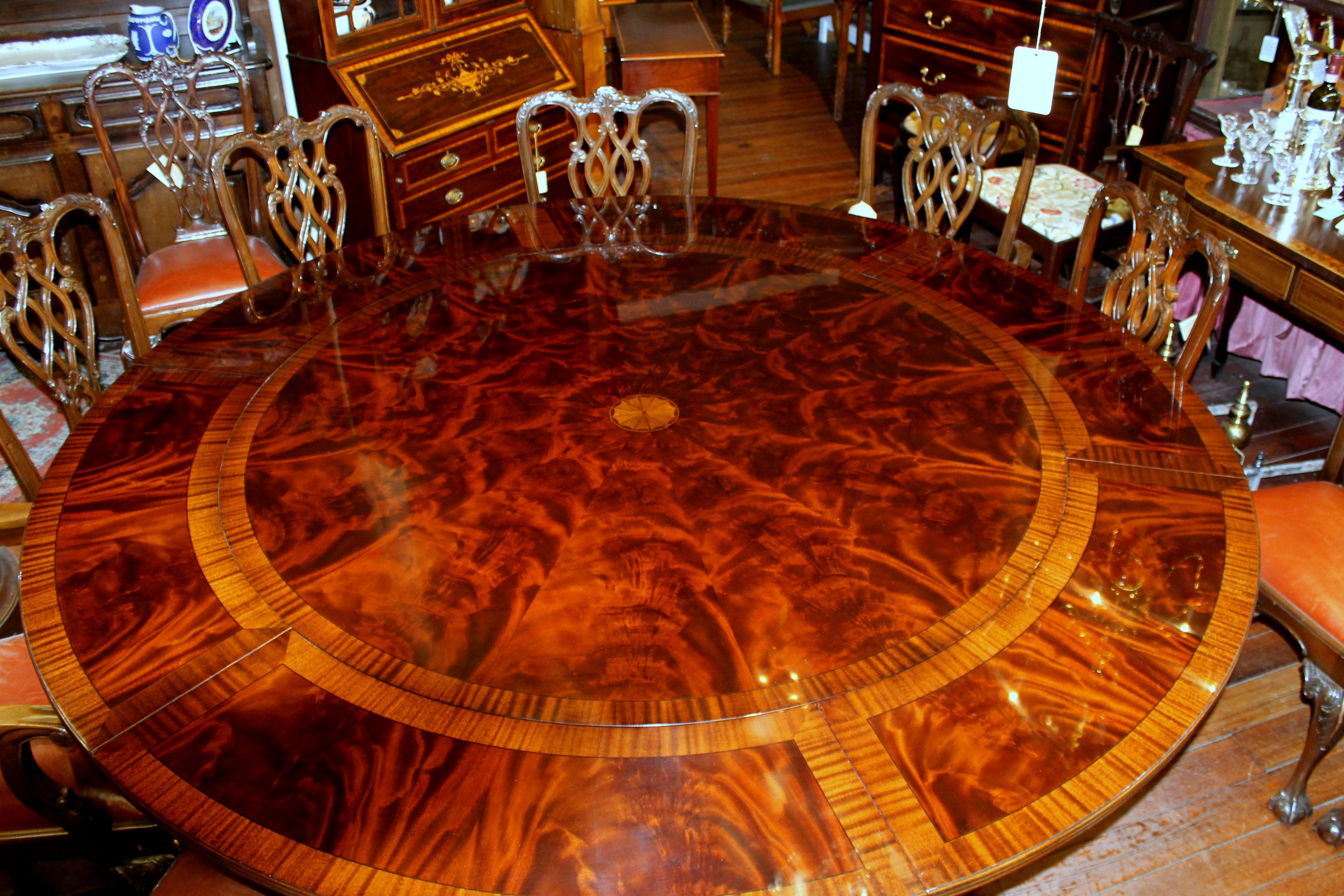 https://a.1stdibscdn.com/benchmade-bookmatched-flame-mahogany-perimeter-leaf-circular-dining-table-for-sale-picture-5/f_18913/f_382502321707060754419/IMG_9000_master.JPG