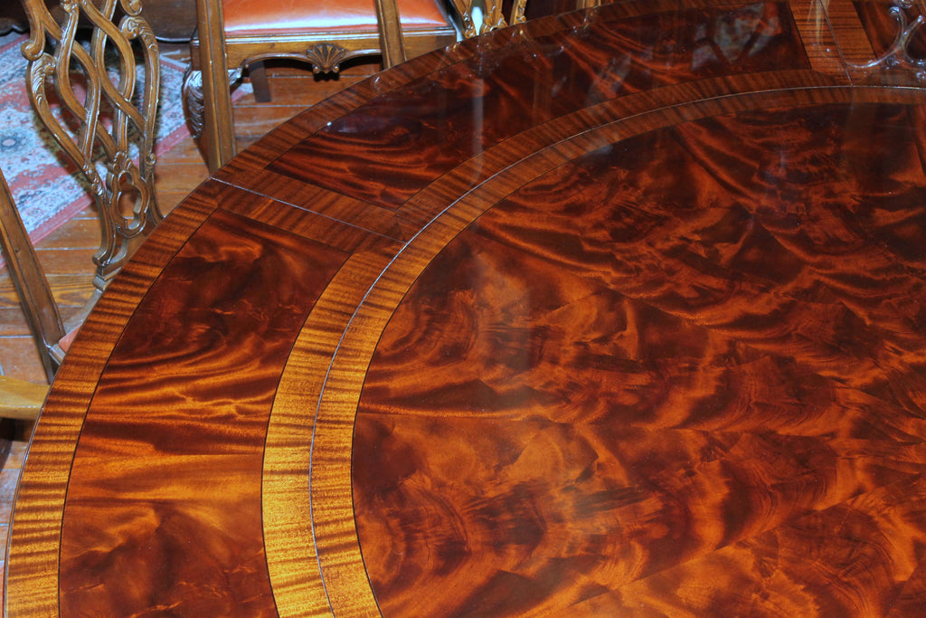 https://a.1stdibscdn.com/benchmade-bookmatched-flame-mahogany-perimeter-leaf-circular-dining-table-for-sale-picture-8/f_18913/f_382502321707060757553/IMG_9003_master.JPG