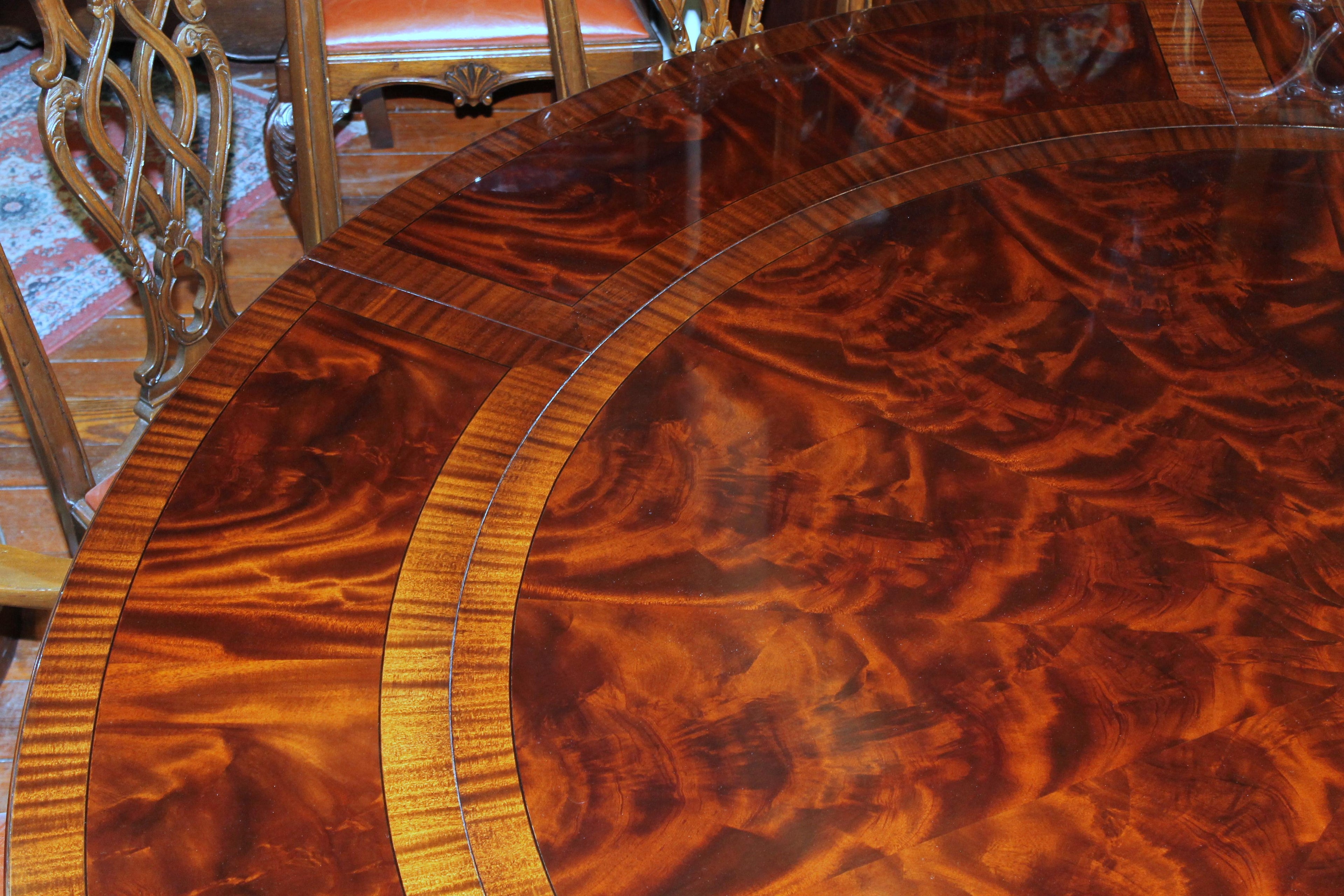 https://a.1stdibscdn.com/benchmade-bookmatched-flame-mahogany-perimeter-leaf-circular-dining-table-for-sale-picture-8/f_18913/f_382502321707060757553/IMG_9003_master.JPG