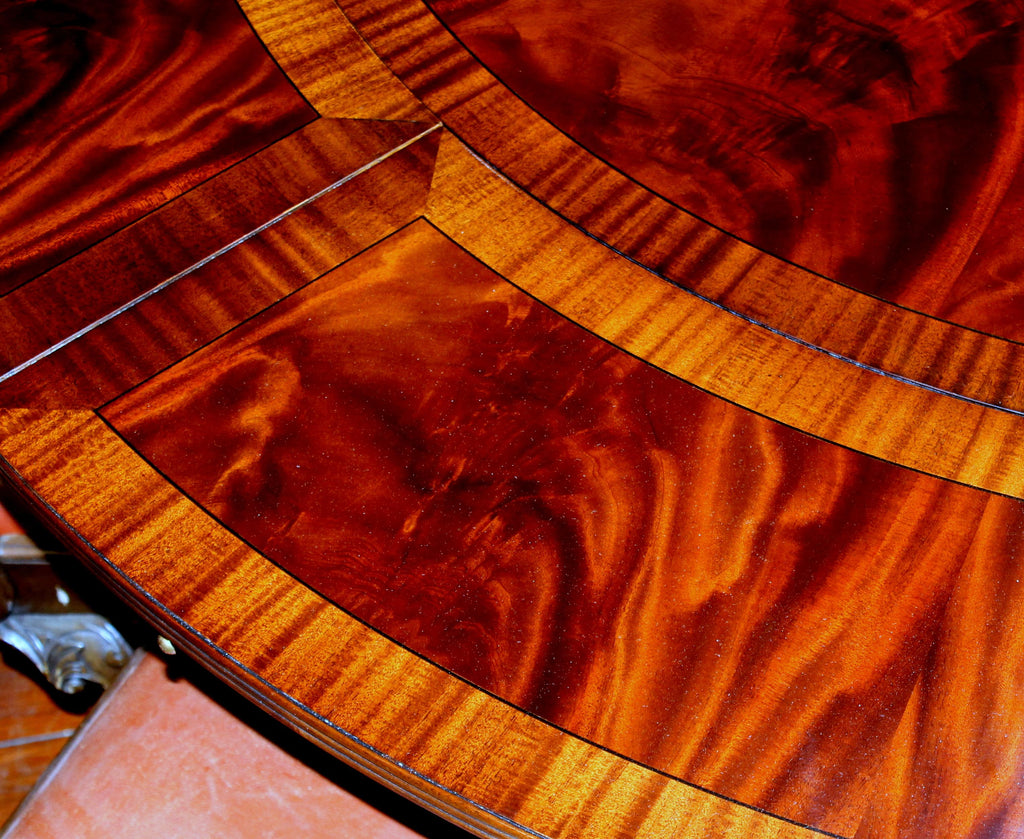 https://a.1stdibscdn.com/benchmade-bookmatched-flame-mahogany-perimeter-leaf-circular-dining-table-for-sale-picture-9/f_18913/f_382502321707060758515/IMG_9004_master.JPG