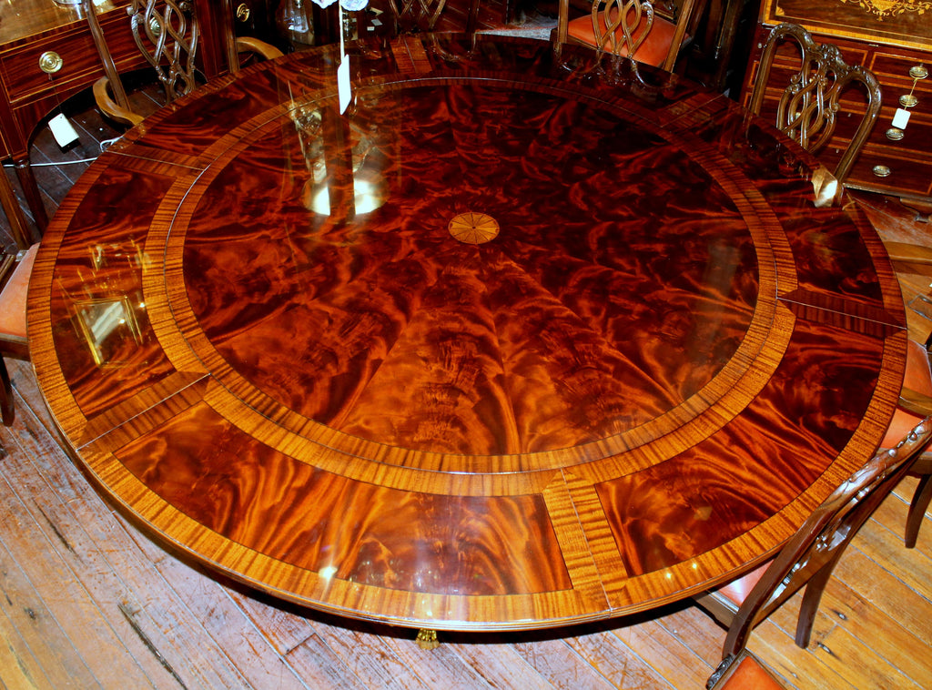 https://a.1stdibscdn.com/benchmade-bookmatched-flame-mahogany-perimeter-leaf-circular-dining-table-for-sale-picture-10/f_18913/f_382502321707060759755/IMG_9005_master.JPG