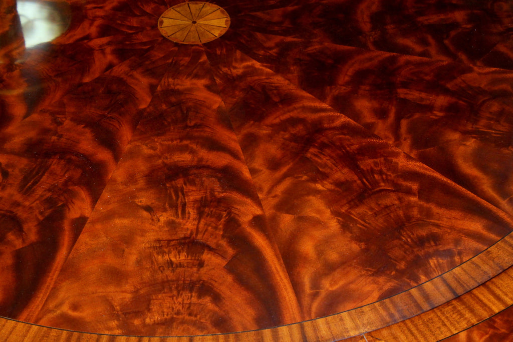 https://a.1stdibscdn.com/benchmade-bookmatched-flame-mahogany-perimeter-leaf-circular-dining-table-for-sale-picture-11/f_18913/f_382502321707060760802/IMG_9006_master.JPG