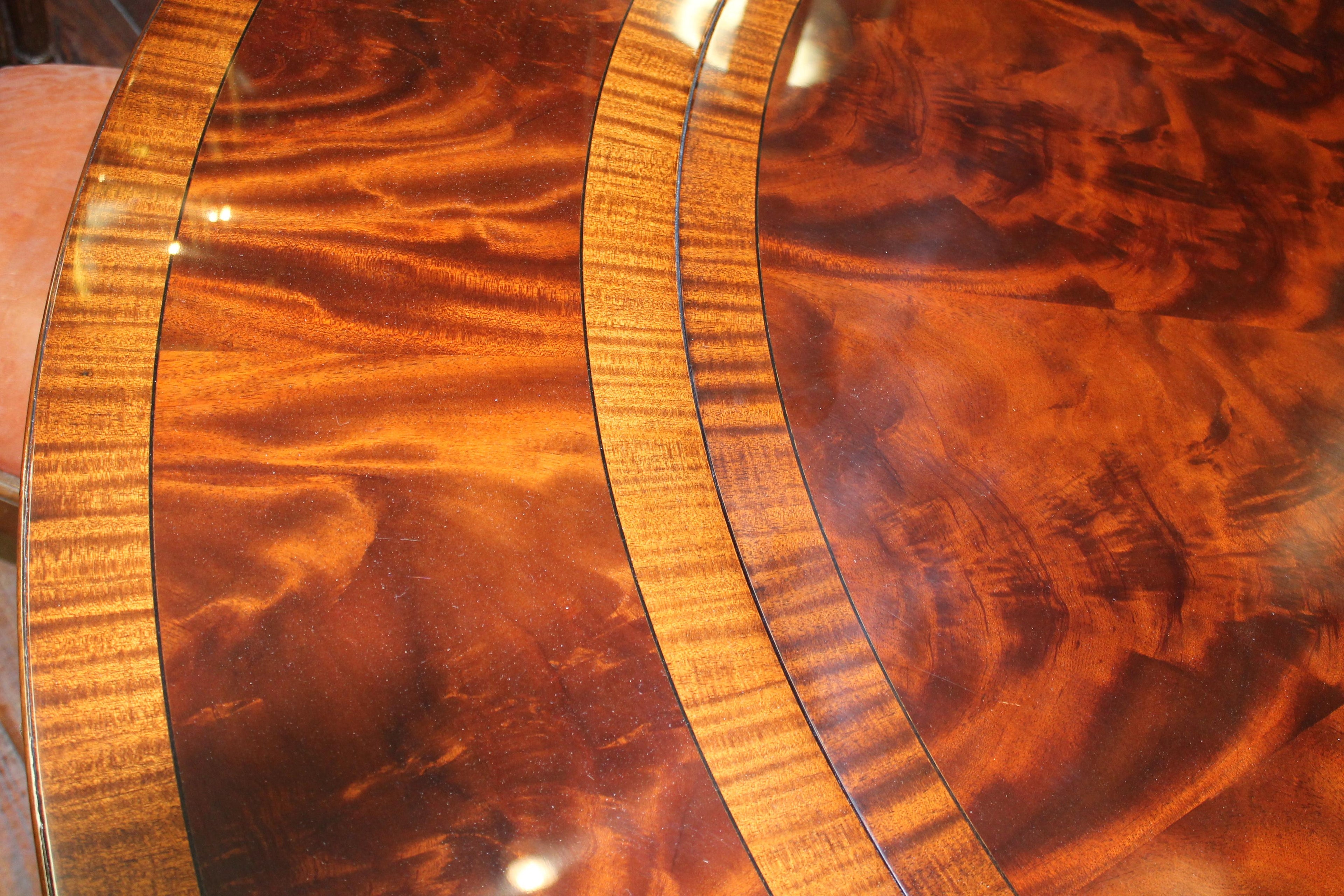 https://a.1stdibscdn.com/benchmade-bookmatched-flame-mahogany-perimeter-leaf-circular-dining-table-for-sale-picture-15/f_18913/f_382502321707060764955/IMG_9010_master.JPG
