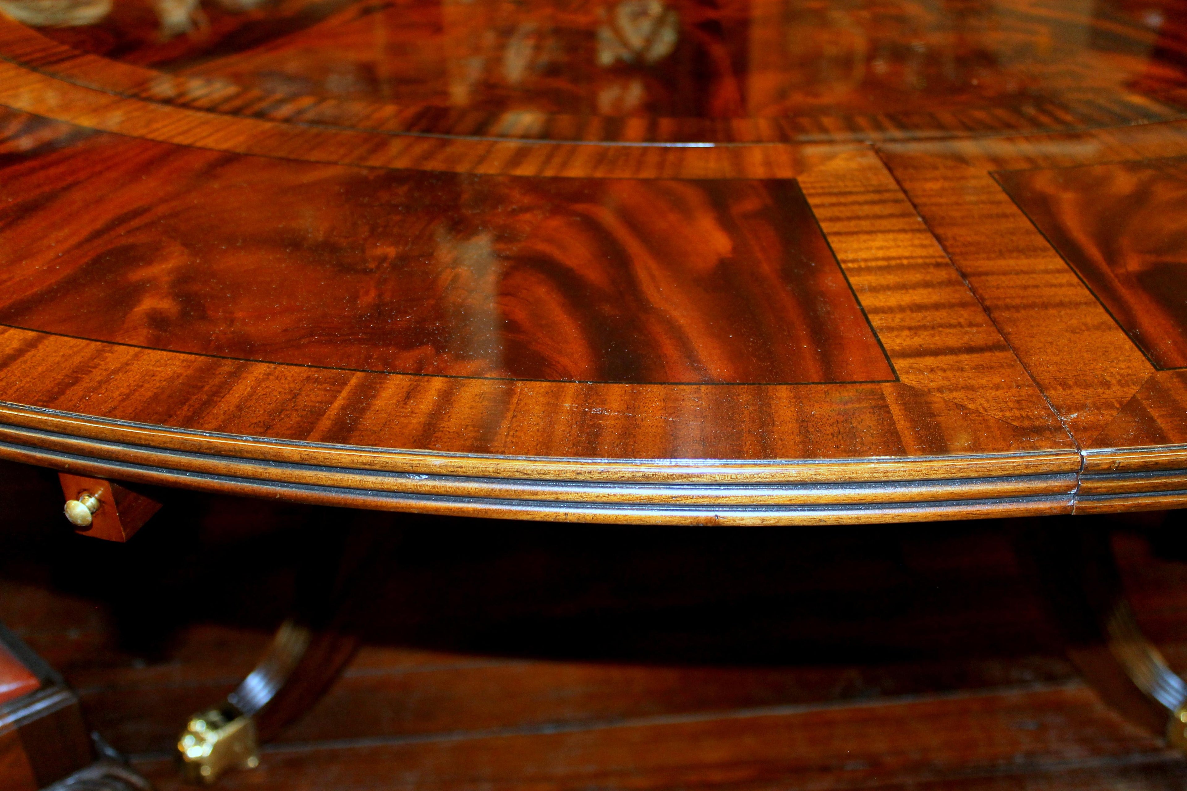 https://a.1stdibscdn.com/benchmade-bookmatched-flame-mahogany-perimeter-leaf-circular-dining-table-for-sale-picture-16/f_18913/f_382502321707060766405/IMG_9011_master.JPG
