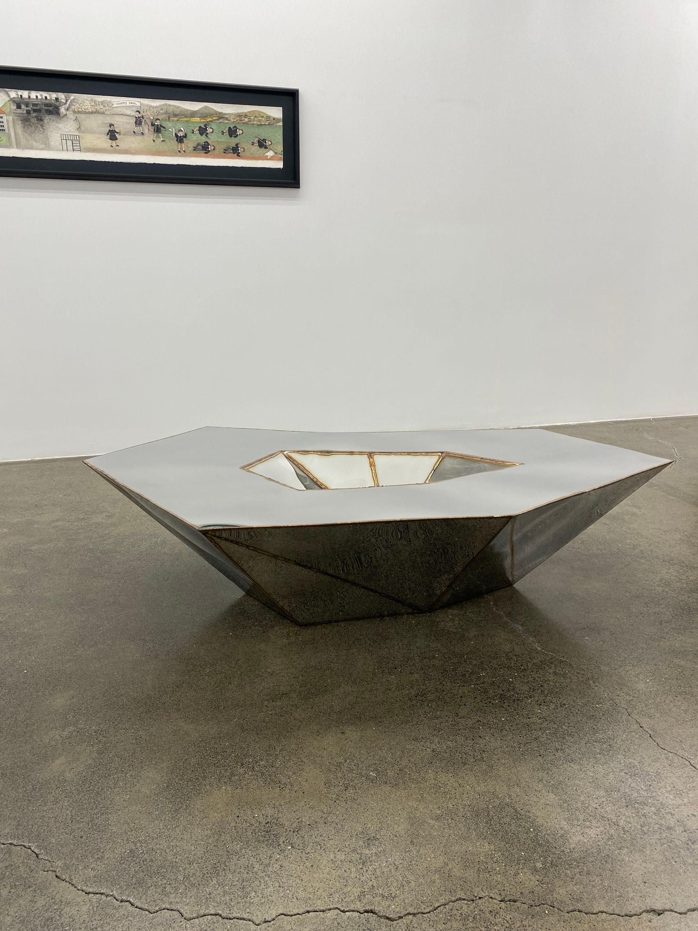 https://a.1stdibscdn.com/lunar-table-in-welded-mirror-polished-stainless-steel-by-julian-mayor-for-sale-picture-4/f_12192/f_459730321753197829499/IMG_9341_master.jpg