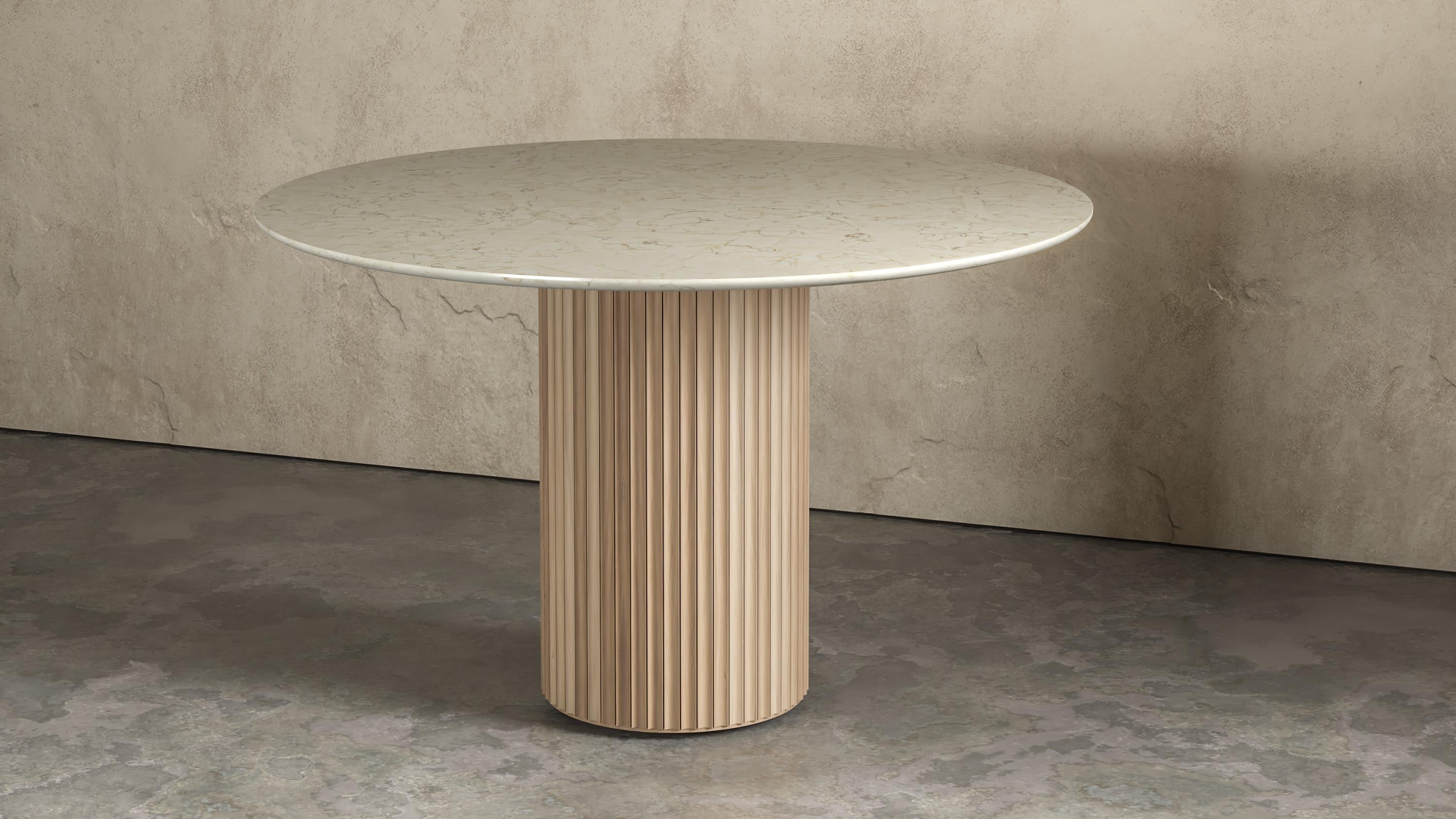 https://a.1stdibscdn.com/fluted-entryway-table-in-solid-wood-pilar-round-dining-table-by-indo--for-sale-picture-2/f_61162/f_270358221648504277962/INDO_Pilar_Round_Dining_Table_Natural_WhiteOak_CM_master.jpg