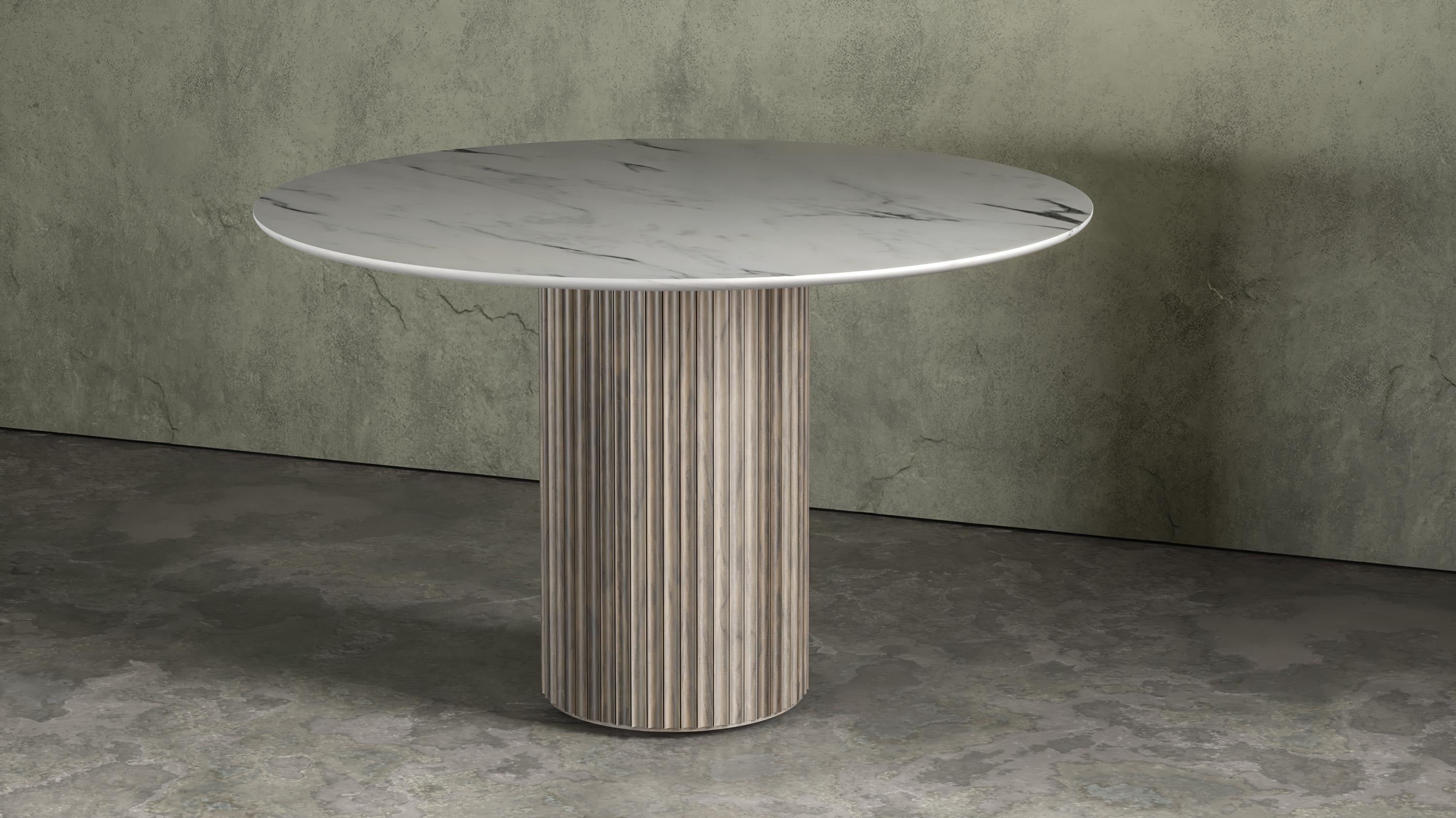 https://a.1stdibscdn.com/fluted-entryway-table-in-solid-wood-pilar-round-dining-table-by-indo--for-sale-picture-3/f_61162/f_270358221648504278317/INDO_Pilar_Round_Dining_Table_Oxidized_Maple_CW_master.jpg