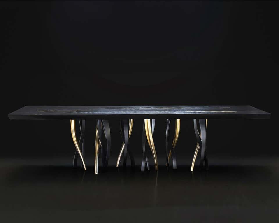 https://a.1stdibscdn.com/black-and-gold-ash-wood-dining-table-made-in-italy-in-stock-in-los-angeles-for-sale-picture-2/f_49571/f_190599221589383889192/Il_Pezzo_8_Black_Table_solo_per_miniatura_catalogo_master_master.jpg