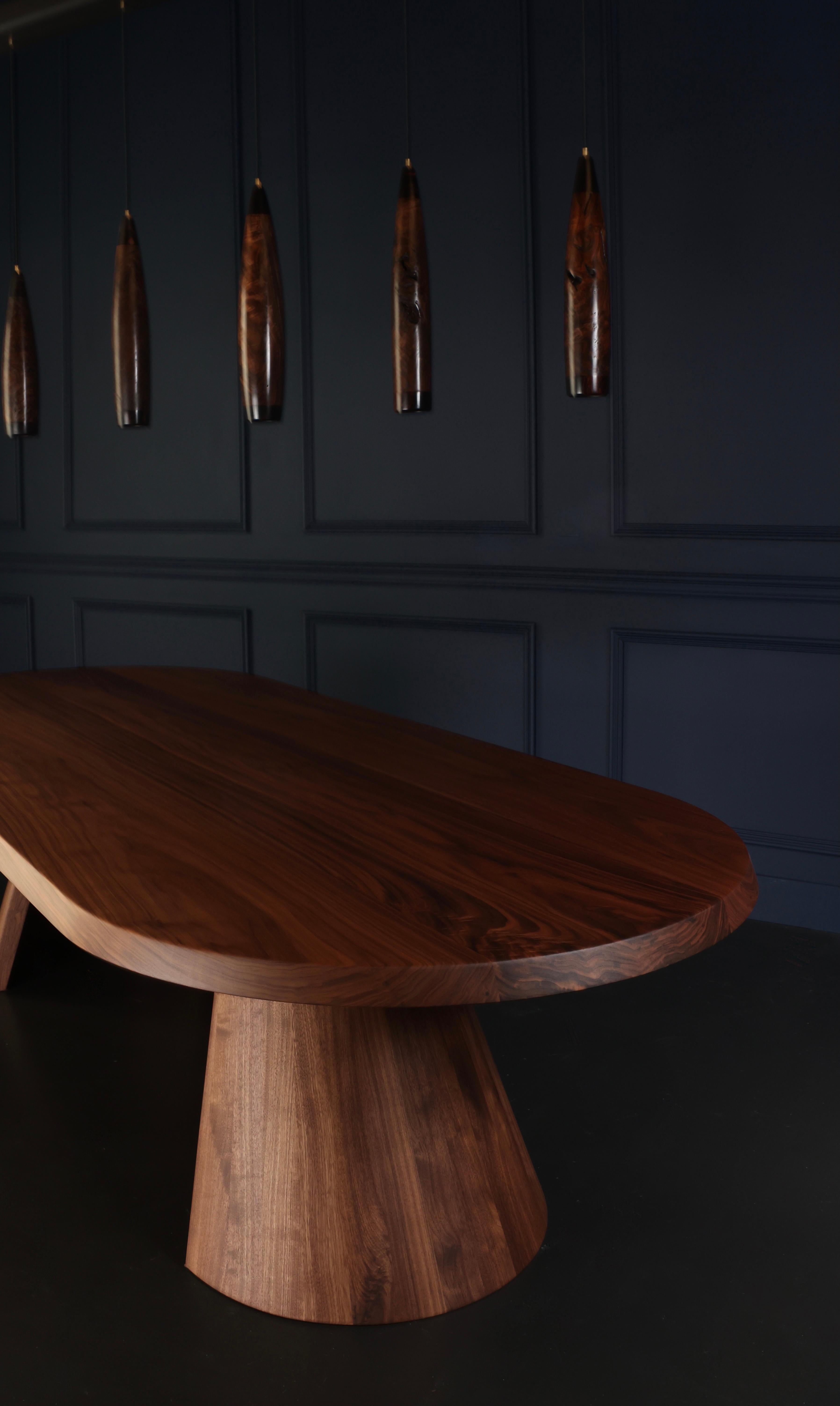 https://a.1stdibscdn.com/solid-walnut-dining-table-turned-cove-base-in-stock-for-sale-picture-9/f_51472/f_248493021628610970577/JJ8A4338_master.jpeg