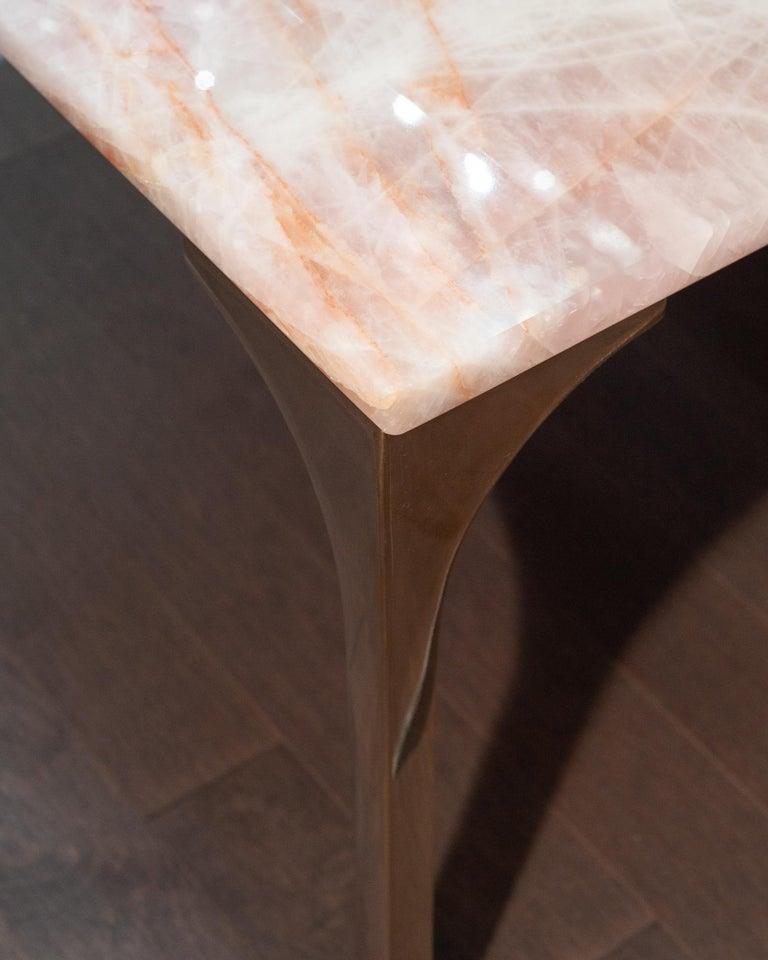 https://a.1stdibscdn.com/studio-maison-nurita-pink-rose-quartz-table-with-polished-poured-bronze-legs-for-sale-picture-3/f_53792/f_483050021768327577022/JMH_7542_master_master.jpg
