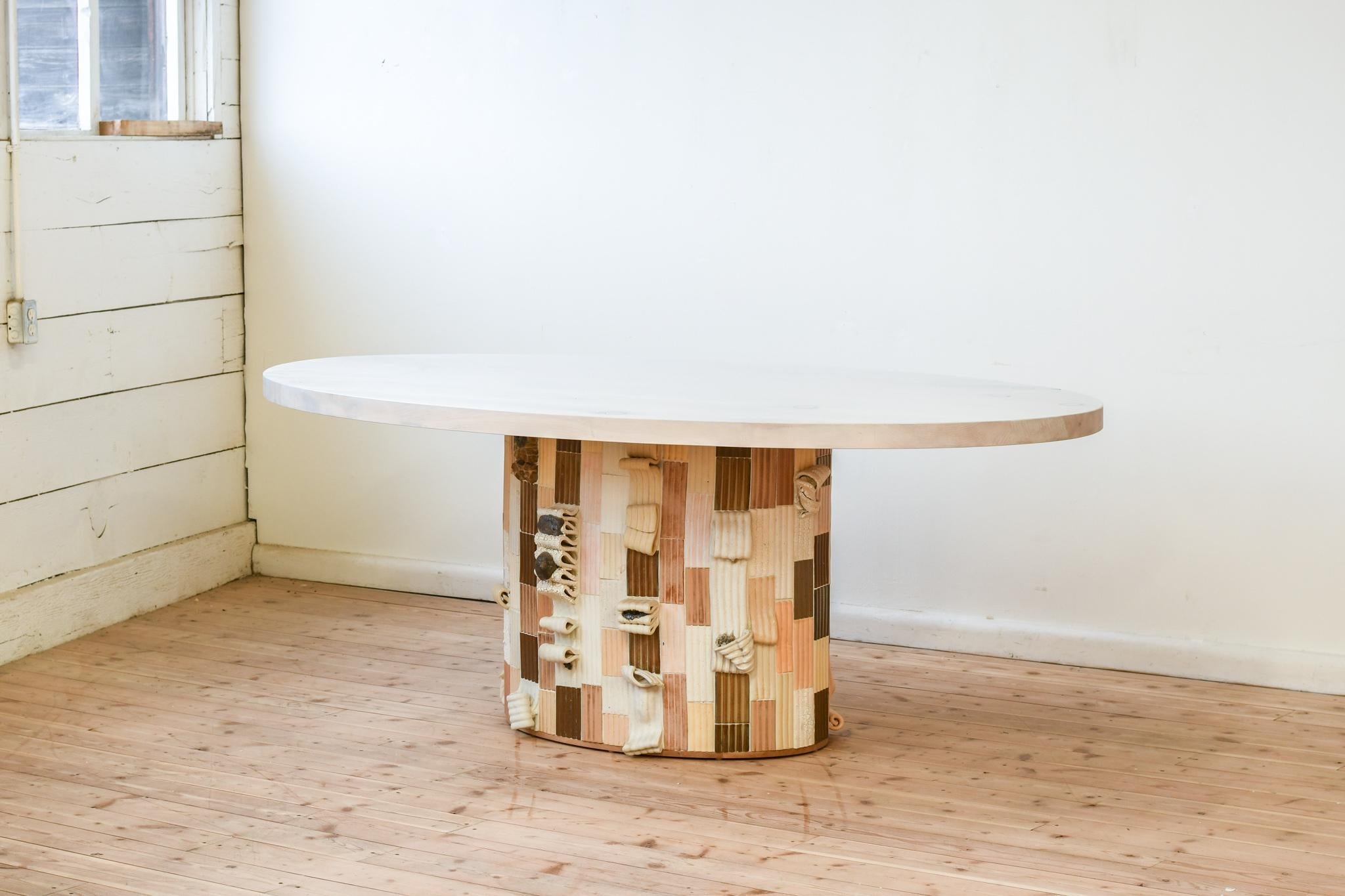 https://a.1stdibscdn.com/sarcophagus-pedestal-dining-table-in-hand-sculpted-ceramic-tiles-for-sale-picture-5/f_35833/f_388666021710534842216/JMJ_6602_master.jpg