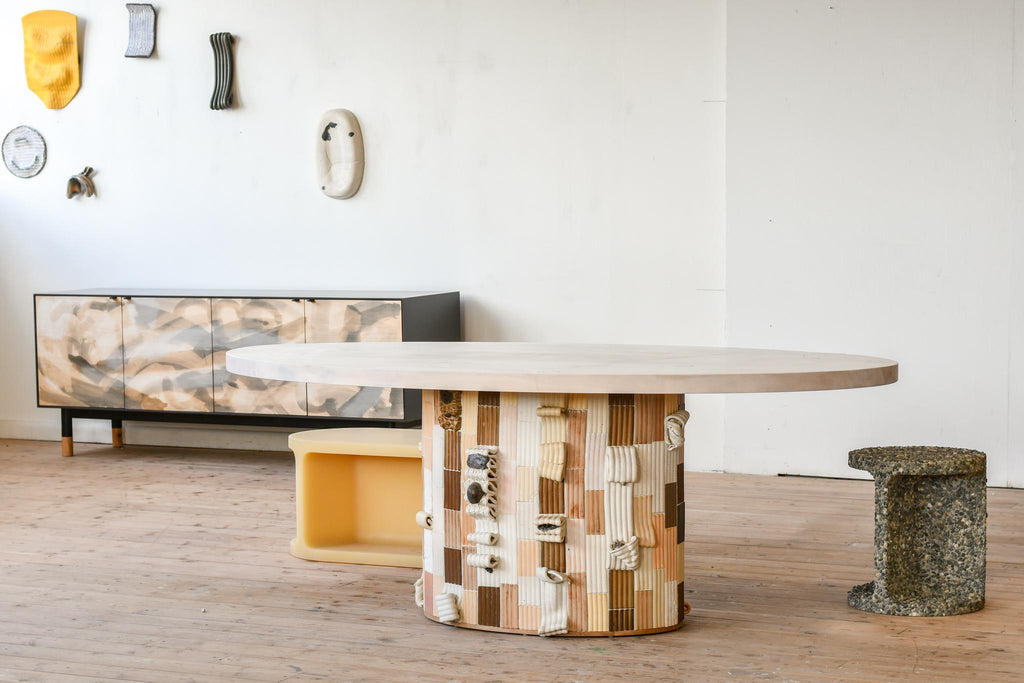 https://a.1stdibscdn.com/sarcophagus-pedestal-dining-table-in-hand-sculpted-ceramic-tiles-for-sale-picture-2/f_35833/f_388666021710534790745/JMJ_6629_master.jpg