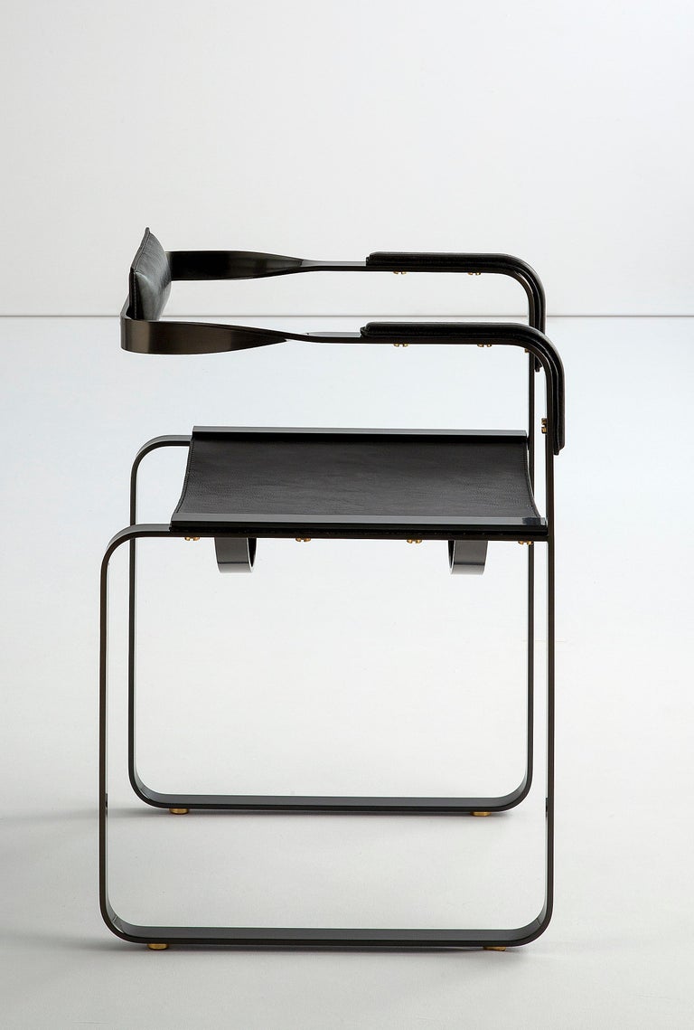 https://a.1stdibscdn.com/armchair-black-smoke-steel-and-black-leather-wanderlust-collection-for-sale-picture-2/f_40561/f_198579521594726966526/Jovervalls_wanderlust_ARMCHAIR_Steel_blacksmoke_LeatherBLACK_04_master.jpg?width=768