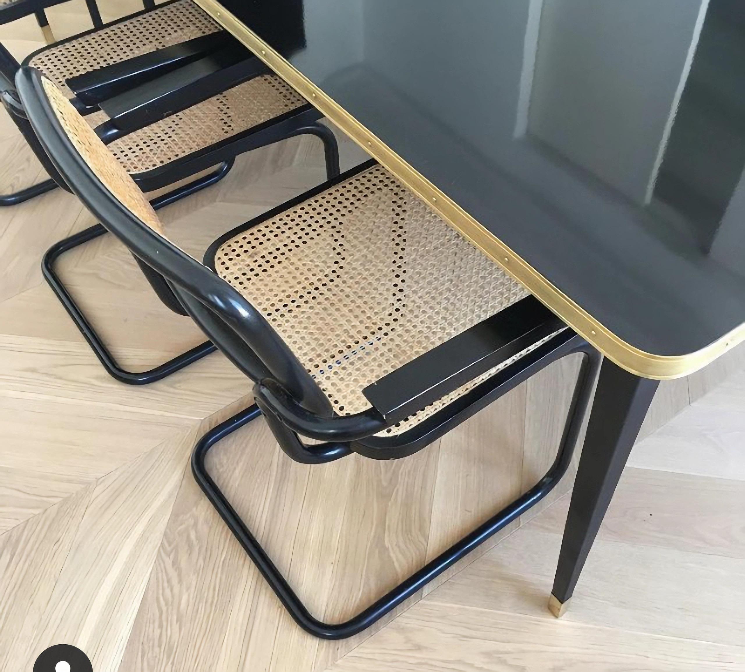 https://a.1stdibscdn.com/rectangular-table-high-gloss-top-brass-framed-black-conic-legs-brass-end-xlarge-for-sale-picture-14/f_40561/f_338247221681550506940/Julieta_Black_BIG__master.jpg