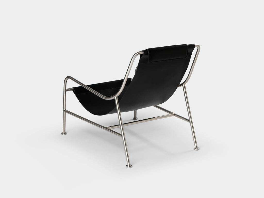 https://a.1stdibscdn.com/minimalist-modern-lounge-chair-in-black-leather-and-brushed-stainless-steel-for-sale-picture-2/f_60192/f_275347621645809504255/LISBOA_lounge_chair_ph_by_Nuno_Sousa_Dias_4_master.jpg