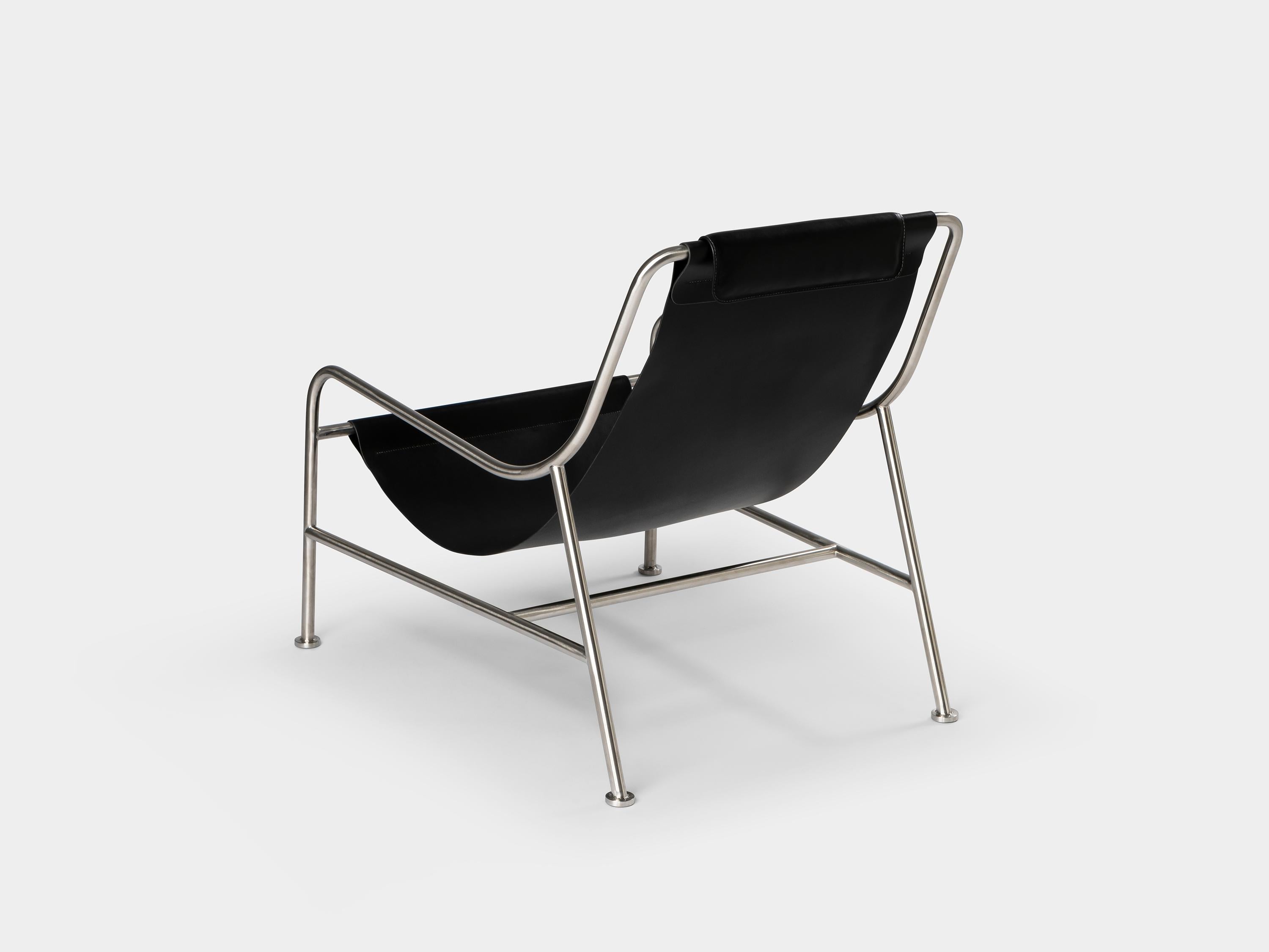 https://a.1stdibscdn.com/minimalist-modern-lounge-chair-in-black-leather-and-brushed-stainless-steel-for-sale-picture-2/f_60192/f_275347621645809504255/LISBOA_lounge_chair_ph_by_Nuno_Sousa_Dias_4_master.jpg