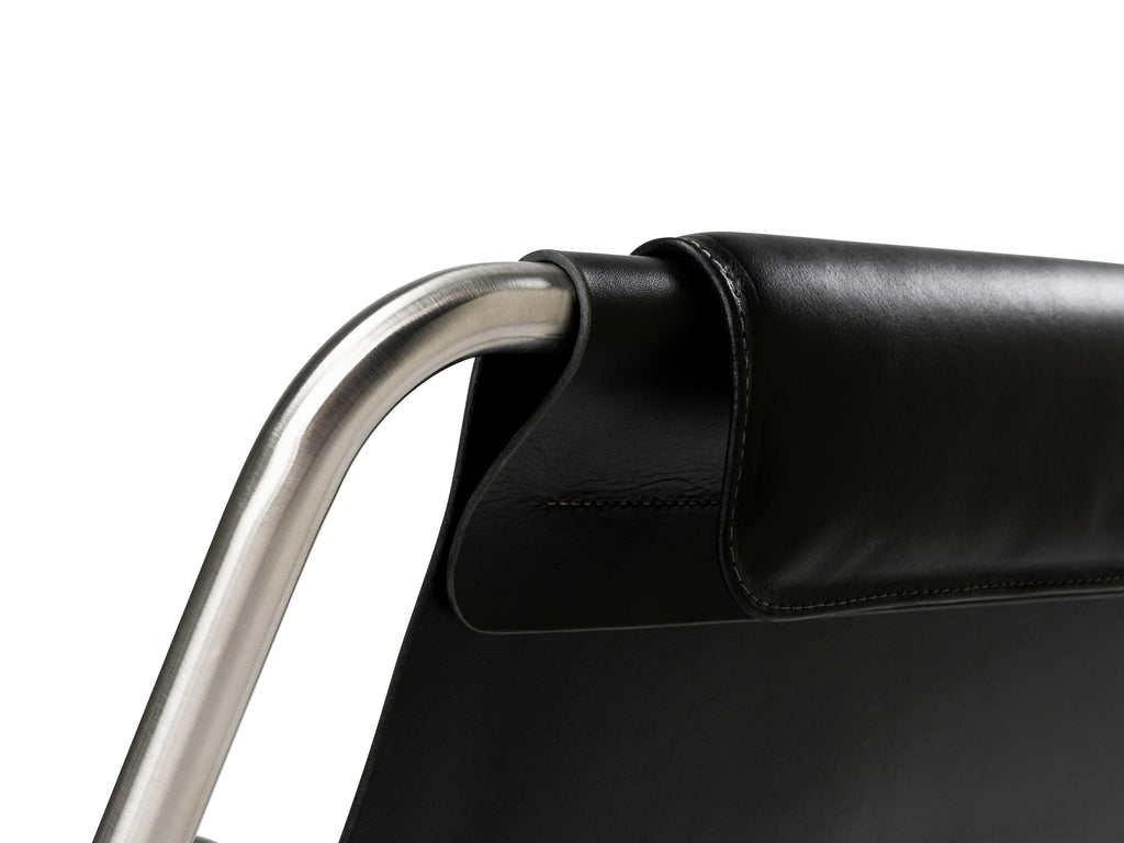 https://a.1stdibscdn.com/minimalist-modern-lounge-chair-in-black-leather-and-brushed-stainless-steel-for-sale-picture-4/f_60192/f_275347621645809504264/LISBOA_lounge_chair_ph_by_Nuno_Sousa_Dias_8_master.jpg