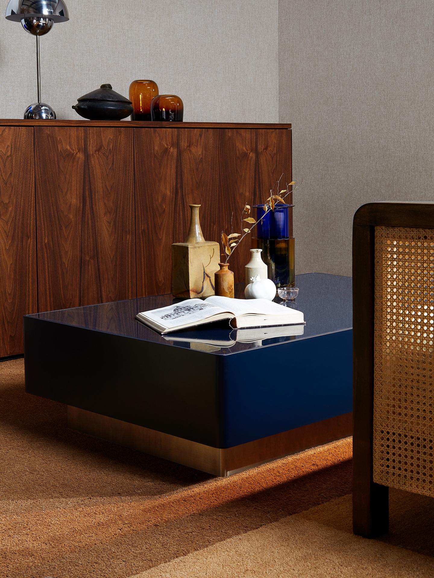 https://a.1stdibscdn.com/chelmsford-lacquered-steel-and-glass-coffee-table-by-kevin-frankental-for-lemon-for-sale-picture-5/f_59512/f_261474521678963397509/Lemon_Furniture_Lifestyle_Chelmsford_1200Wx800Wx310H_Navy_Brass_CCT12BSBNA_01_master.jpg