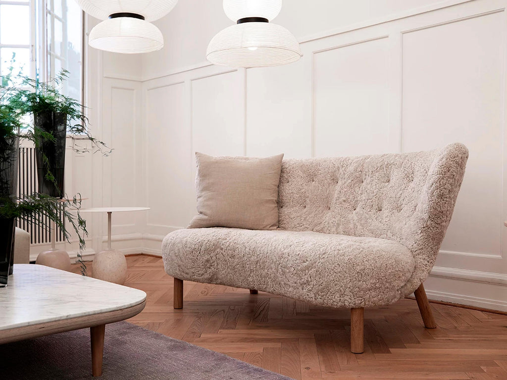https://a.1stdibscdn.com/little-petra-sofa-by-viggo-boesen-in-sheepskin-moonlight-oiled-oak-for-t-for-sale-picture-7/f_51432/f_487443021770730882583/Lifestyle_Little_Petra_Sofa_VB2_Oak_and_Moonlight_Sheepskin_master.jpg