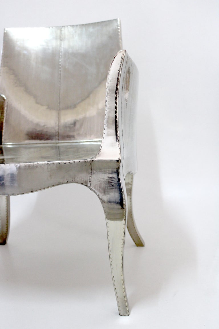 https://a.1stdibscdn.com/louis-xvi-chair-in-white-bronze-metal-clad-over-teak-club-chair-by-p-mathieu-for-sale-picture-4/f_42361/f_318031221671403648326/Louise_Silver_Club_Chair_4__master.jpg?width=768