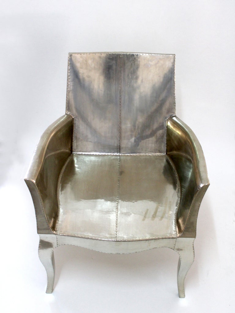 https://a.1stdibscdn.com/louis-xvi-chair-in-white-bronze-metal-clad-over-teak-club-chair-by-p-mathieu-for-sale-picture-5/f_42361/f_318031221671403649080/Louise_Silver_Club_Chair_5__master.jpg?width=768