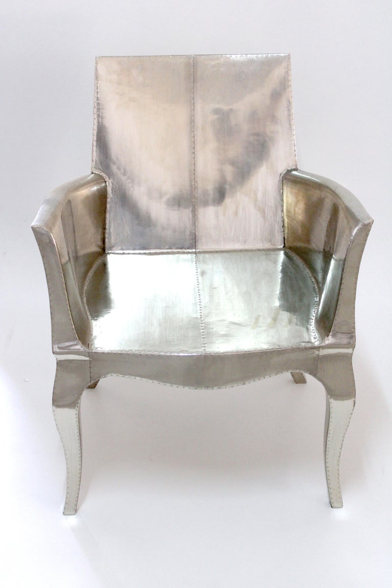 https://a.1stdibscdn.com/louis-xvi-chair-in-white-bronze-metal-clad-over-teak-club-chair-by-p-mathieu-for-sale-picture-6/f_42361/f_318031221671403654865/Louise_Silver_Club_Chair_6__master.jpg?width=768