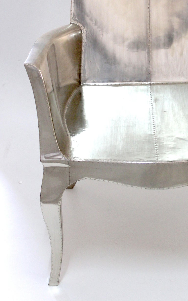https://a.1stdibscdn.com/louis-xvi-chair-in-white-bronze-metal-clad-over-teak-club-chair-by-p-mathieu-for-sale-picture-7/f_42361/f_318031221671403655586/Louise_Silver_Club_Chair_7__master.jpg?width=768