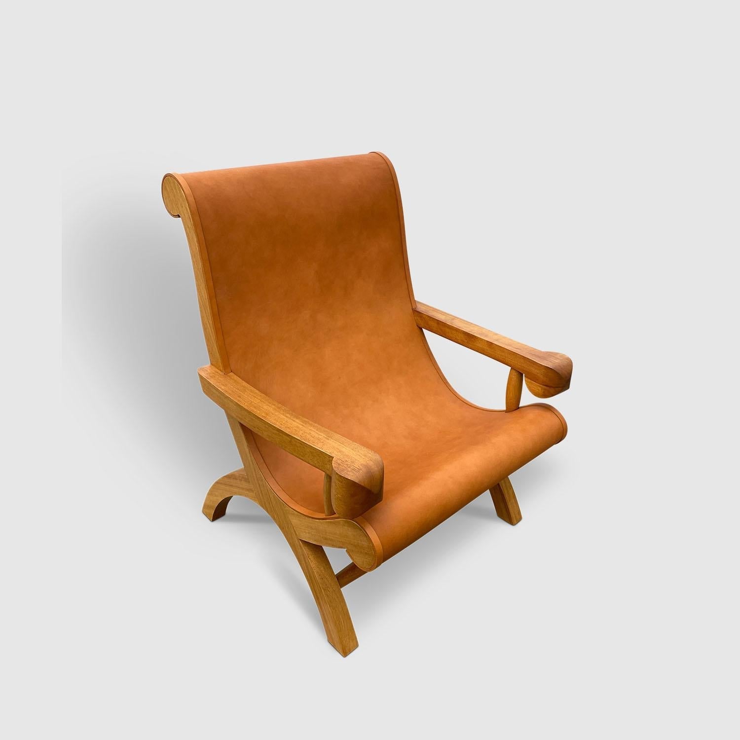 https://a.1stdibscdn.com/butaque-armchair-licensed-reedition-tropical-hardwood-tan-leather-in-stock-for-sale-picture-3/f_34063/f_483881321768836421958/Luteca_Butaque_Armchair_Teak_Tan_Hide_W2_master.jpg