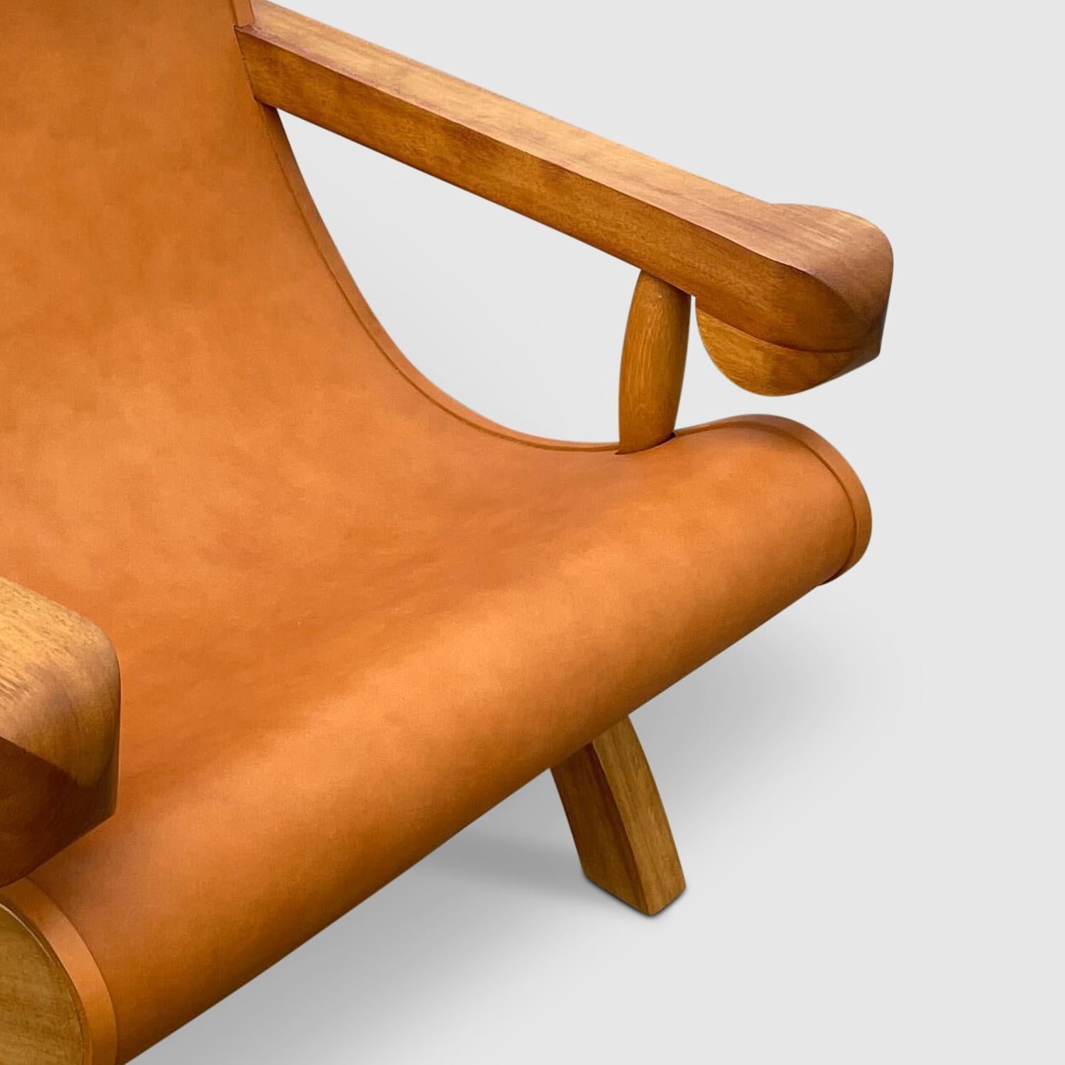https://a.1stdibscdn.com/butaque-armchair-licensed-reedition-tropical-hardwood-tan-leather-in-stock-for-sale-picture-7/f_34063/f_483881321768836422358/Luteca_Butaque_Armchair_Teak_Tan_Hide_W6_master.jpg