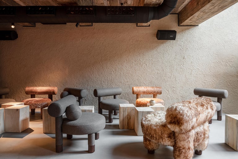 https://a.1stdibscdn.com/accent-low-chair-gropius-cs2-fluffy-in-azur-faux-fur-with-wooden-legs-by-noom-for-sale-picture-8/f_42321/f_422472121773330467818/MAD_BarsHouse_by_YOD_6floor_photoYevheniiAvramenko_15__master.jpg?width=768